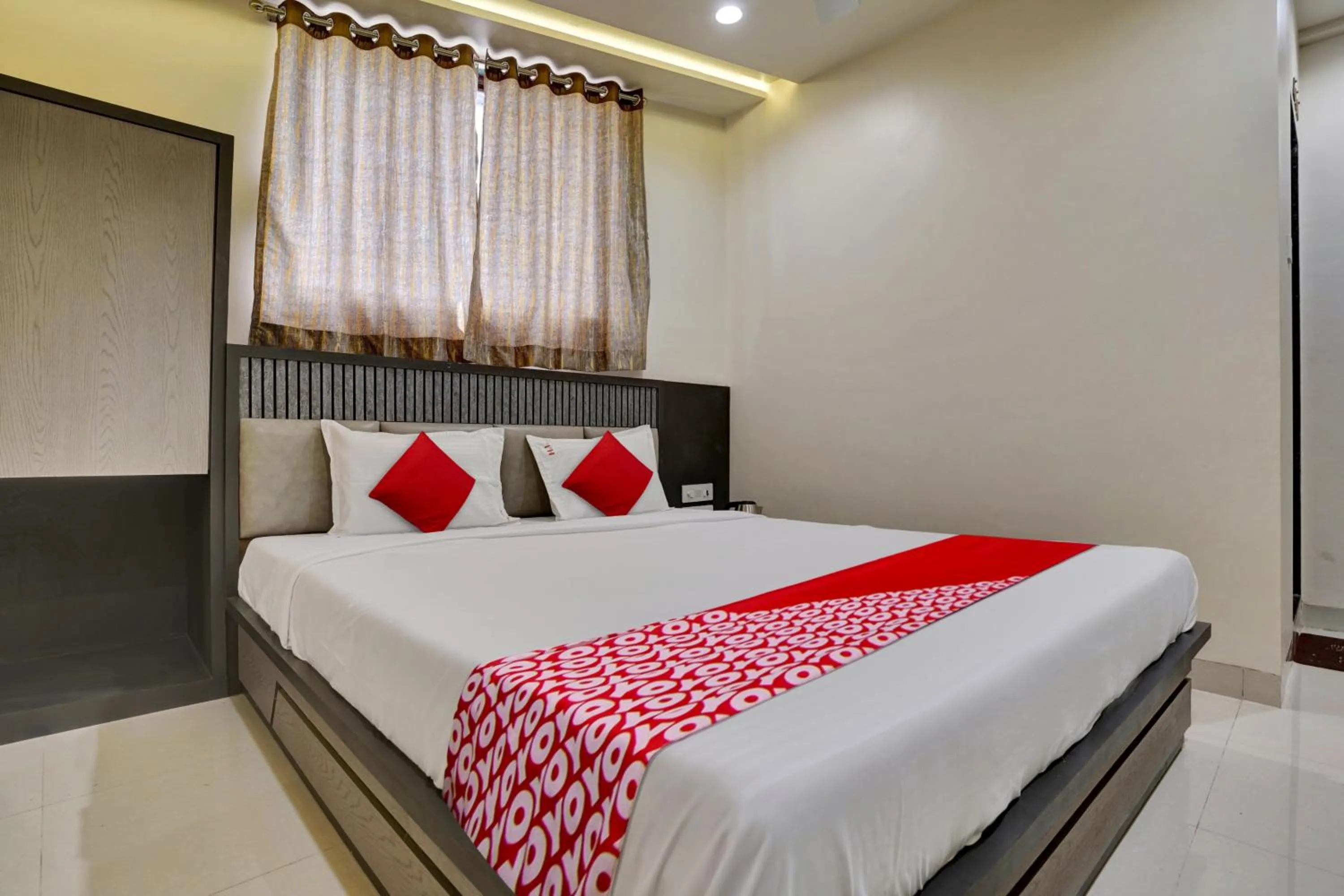 Bedroom in Hotel O Dhiman Residency