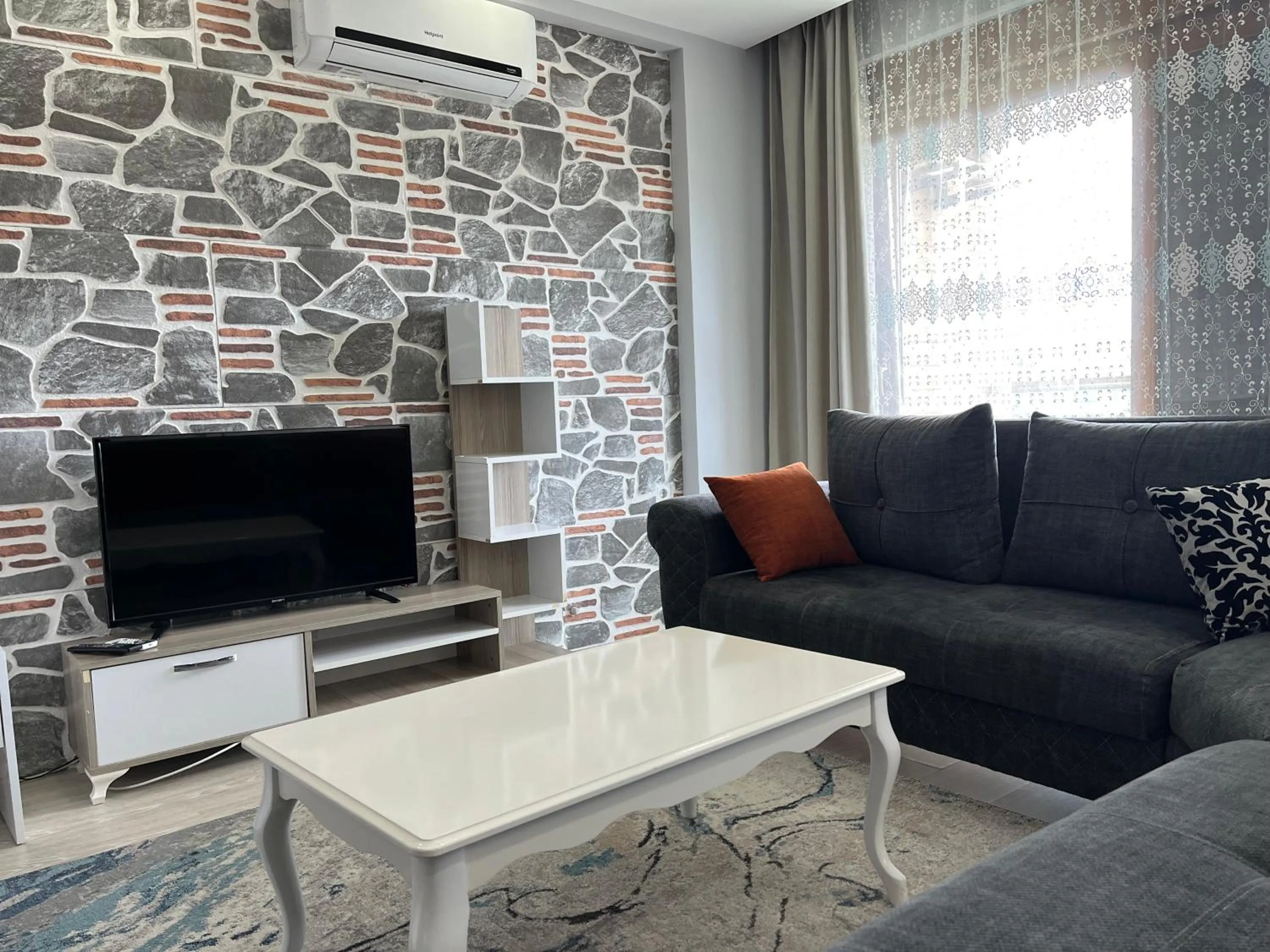 Communal lounge/ TV room in Gardenya Lara Suit Hotel