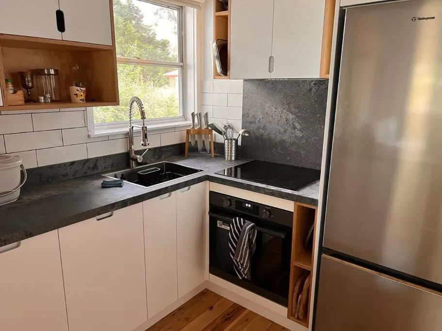 Kitchen or kitchenette in Sunflower House, a cozy cabin at Lake Wentworth