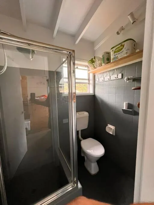 Shower in Sunflower House, a cozy cabin at Lake Wentworth