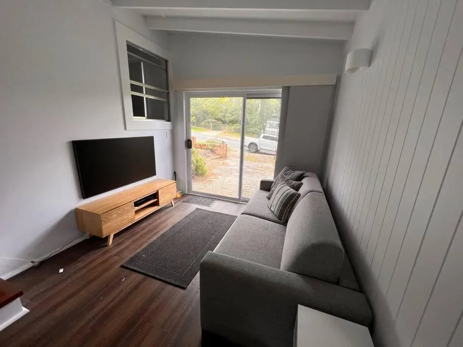 TV and multimedia in Sunflower House, a cozy cabin at Lake Wentworth