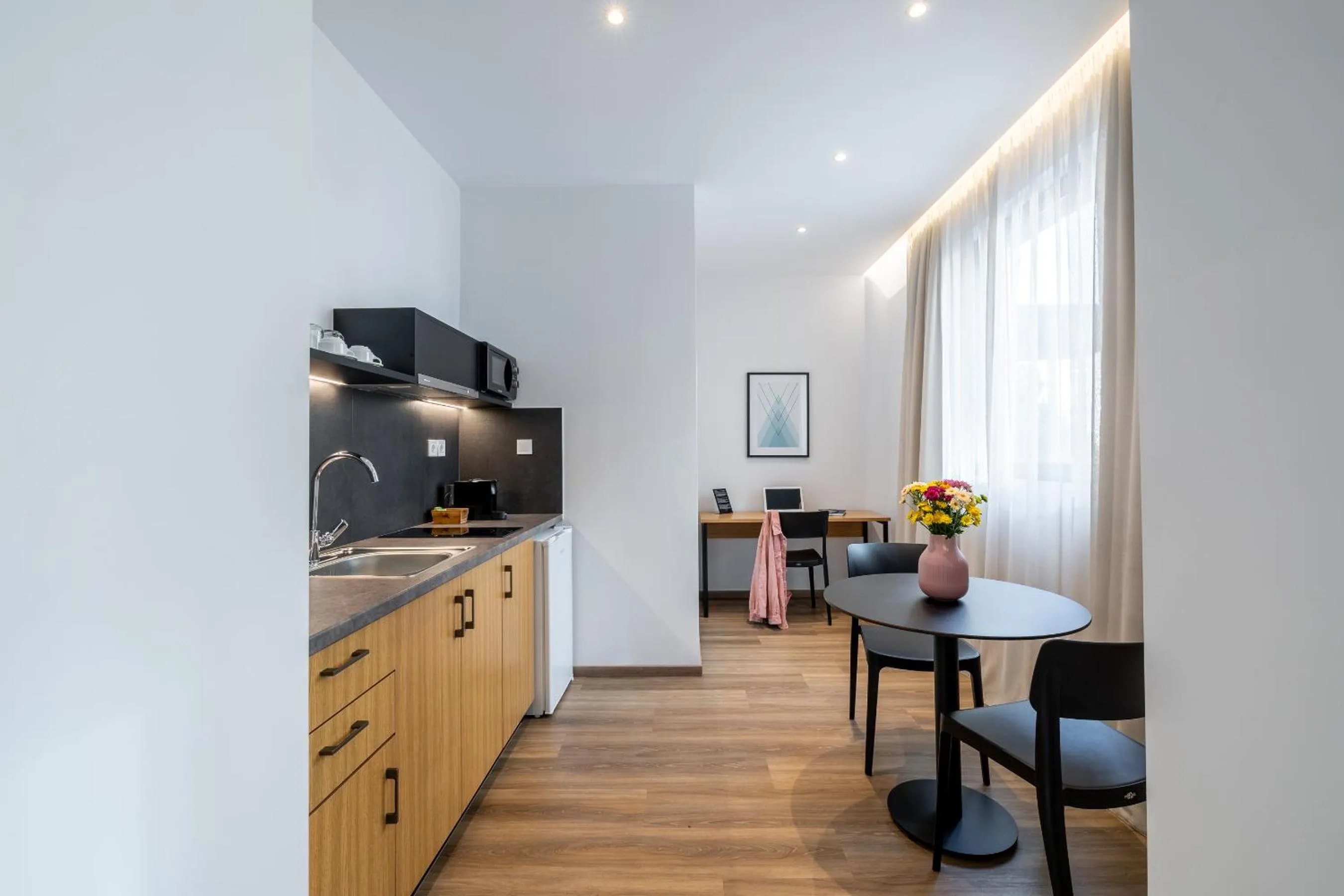 Kitchen or kitchenette in Pnoe Urban Living