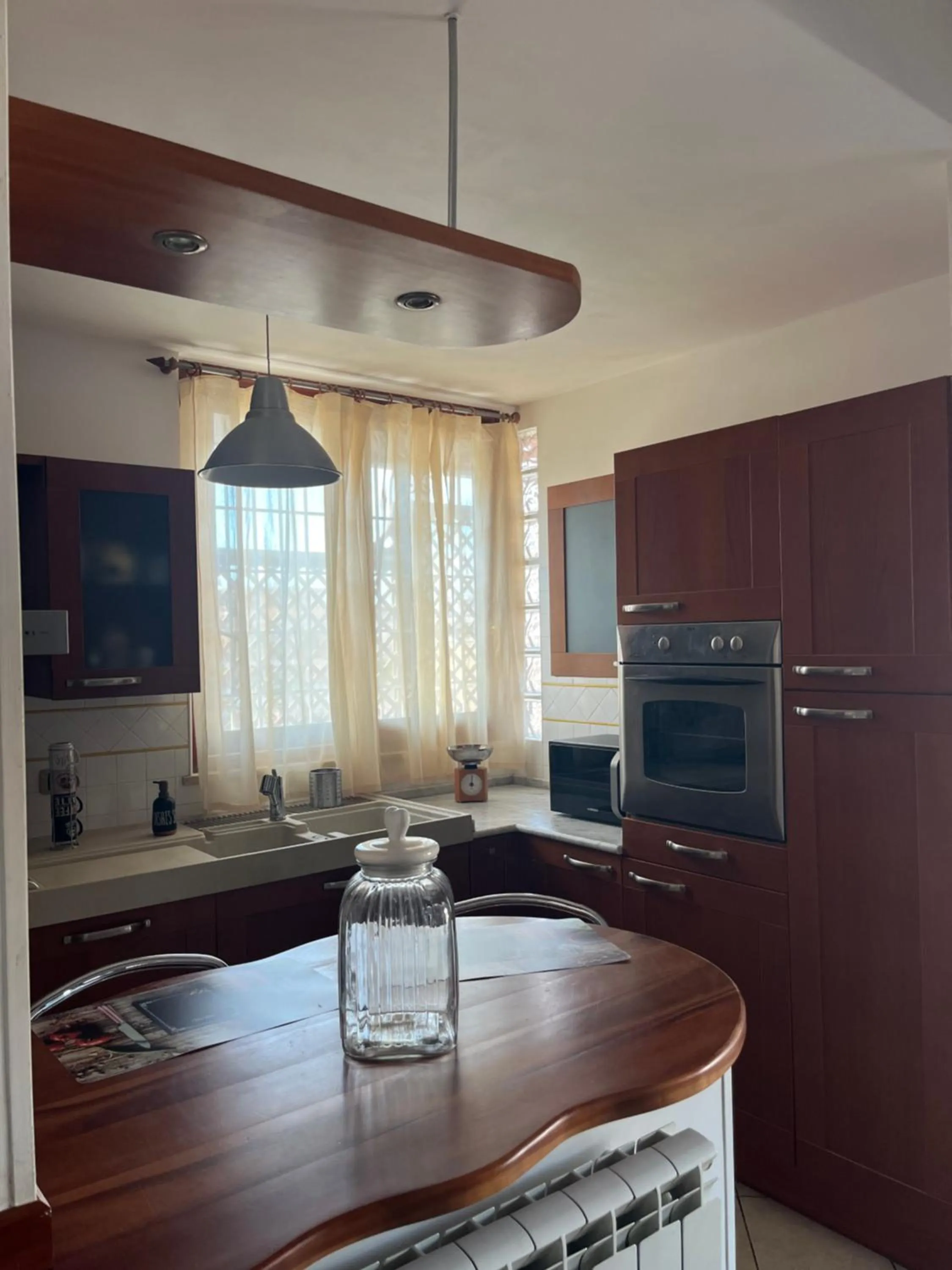 Kitchen or kitchenette in Attico con terrazza in Via dei Traghetti