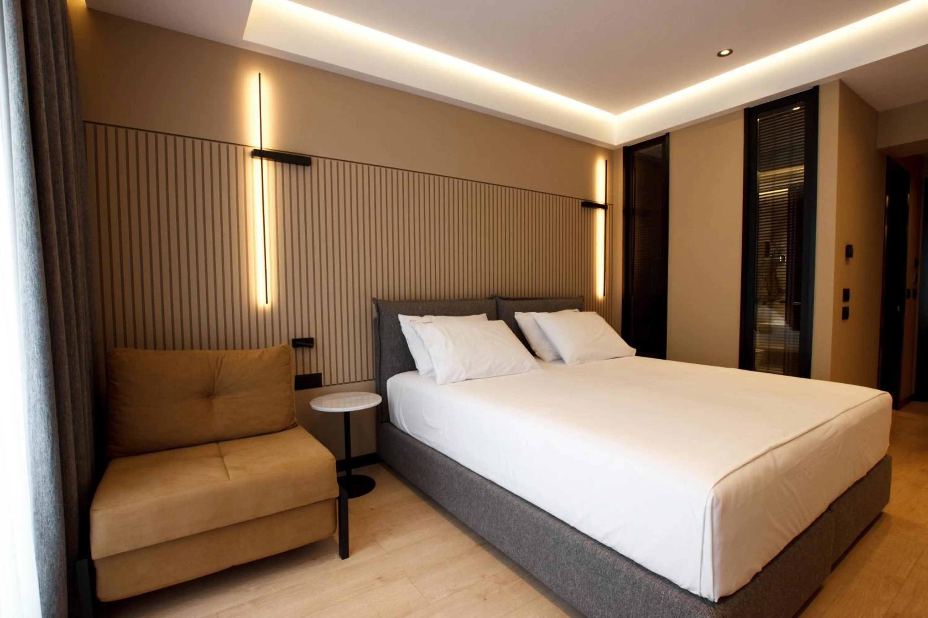 Bed in Caramel Boutique Hotel