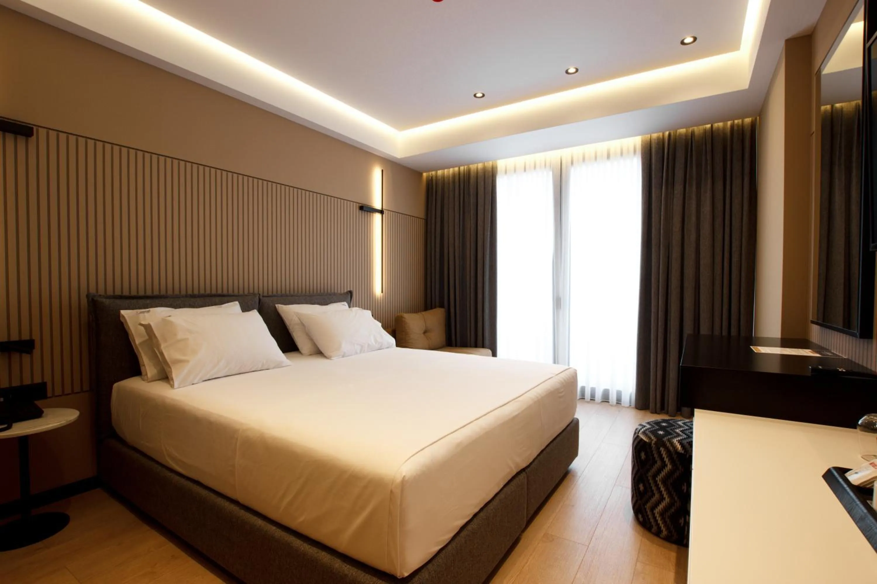 Bed in Caramel Boutique Hotel