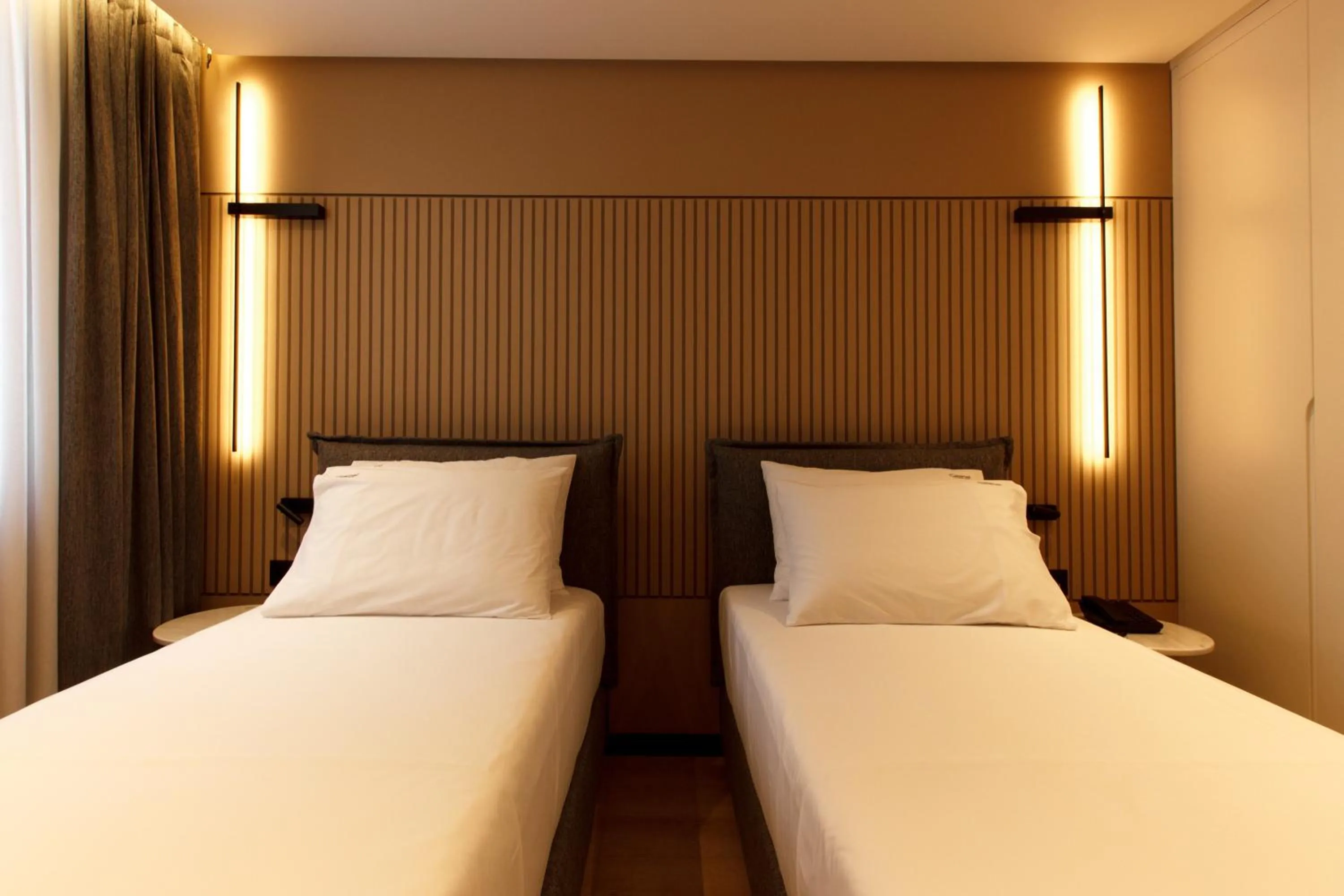 Bed in Caramel Boutique Hotel