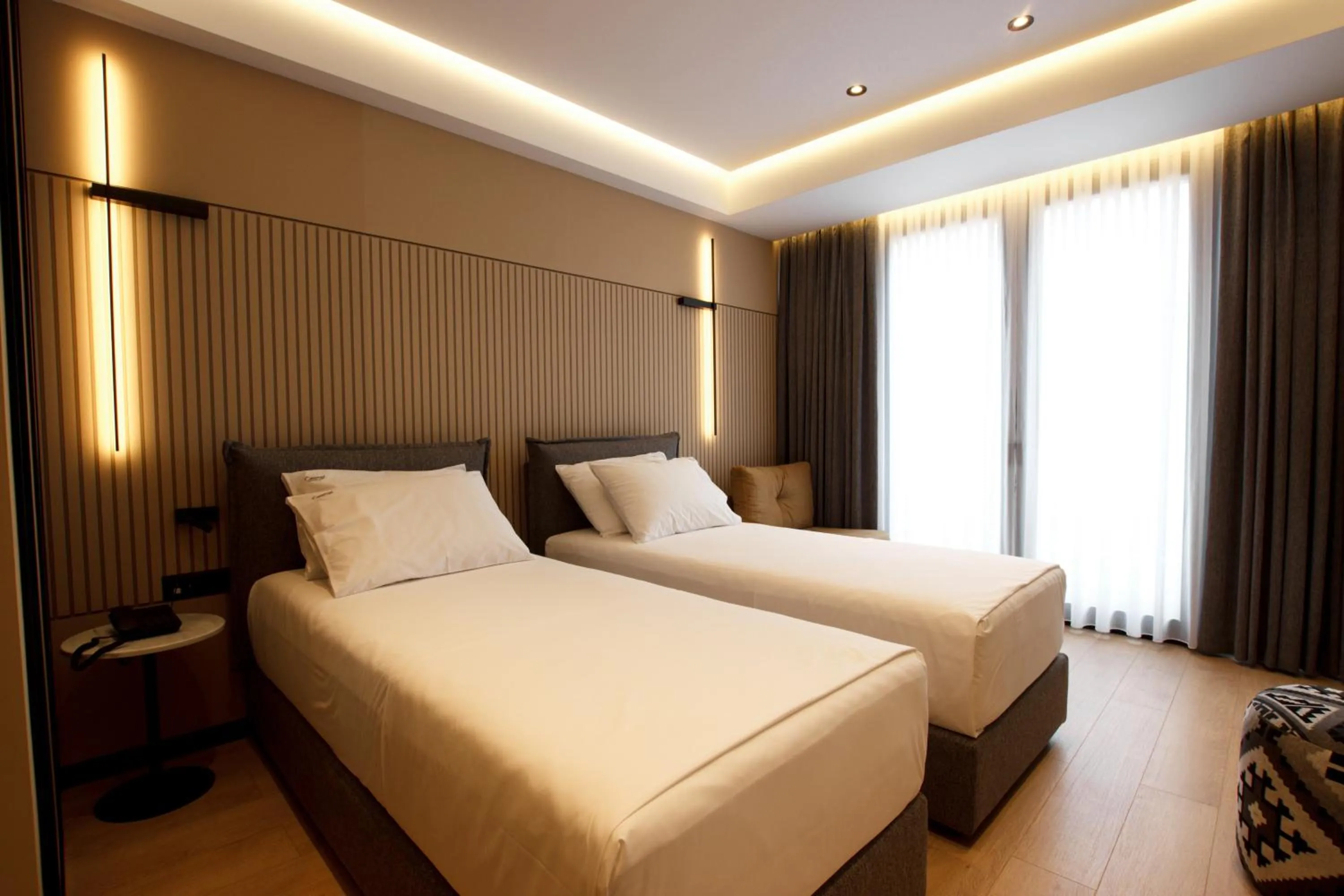 Bed in Caramel Boutique Hotel