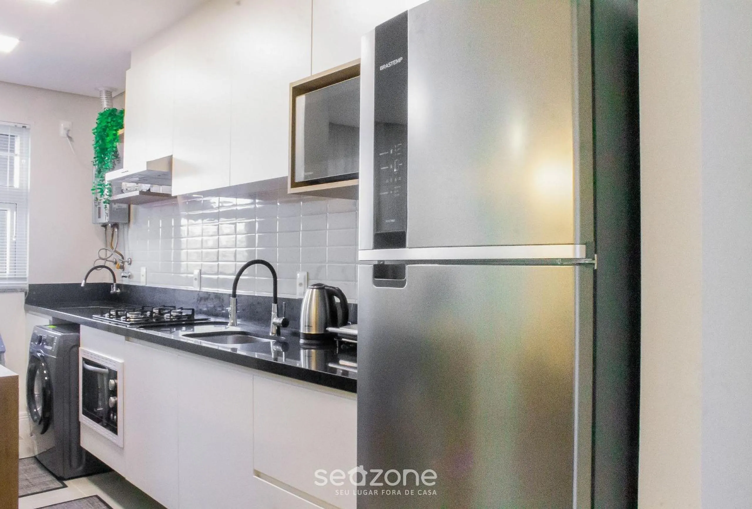 Kitchen or kitchenette in Apto moderno com piscina e churrasqueira CRR201