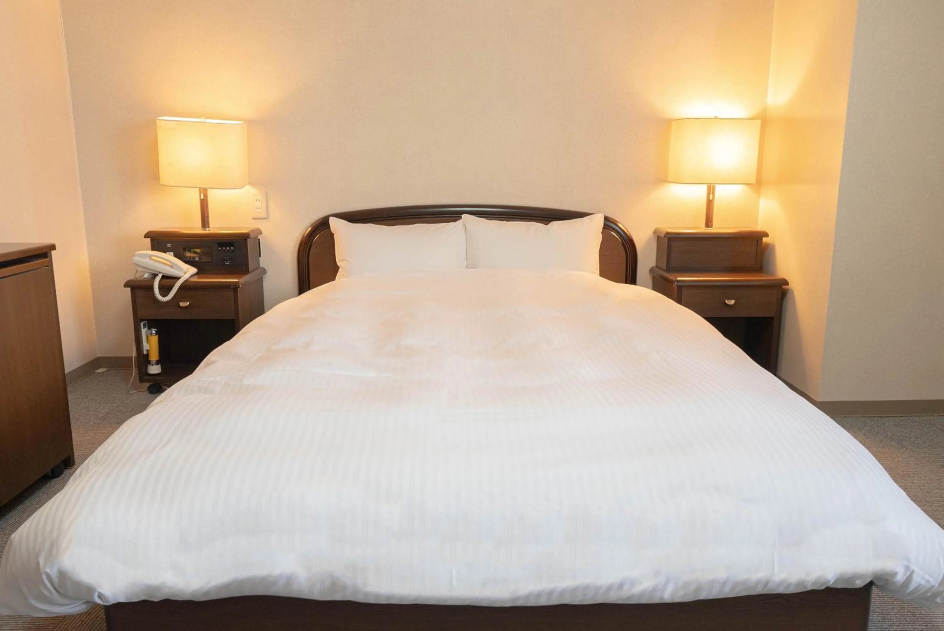 Bed in Hotel Alpha Inn Akita