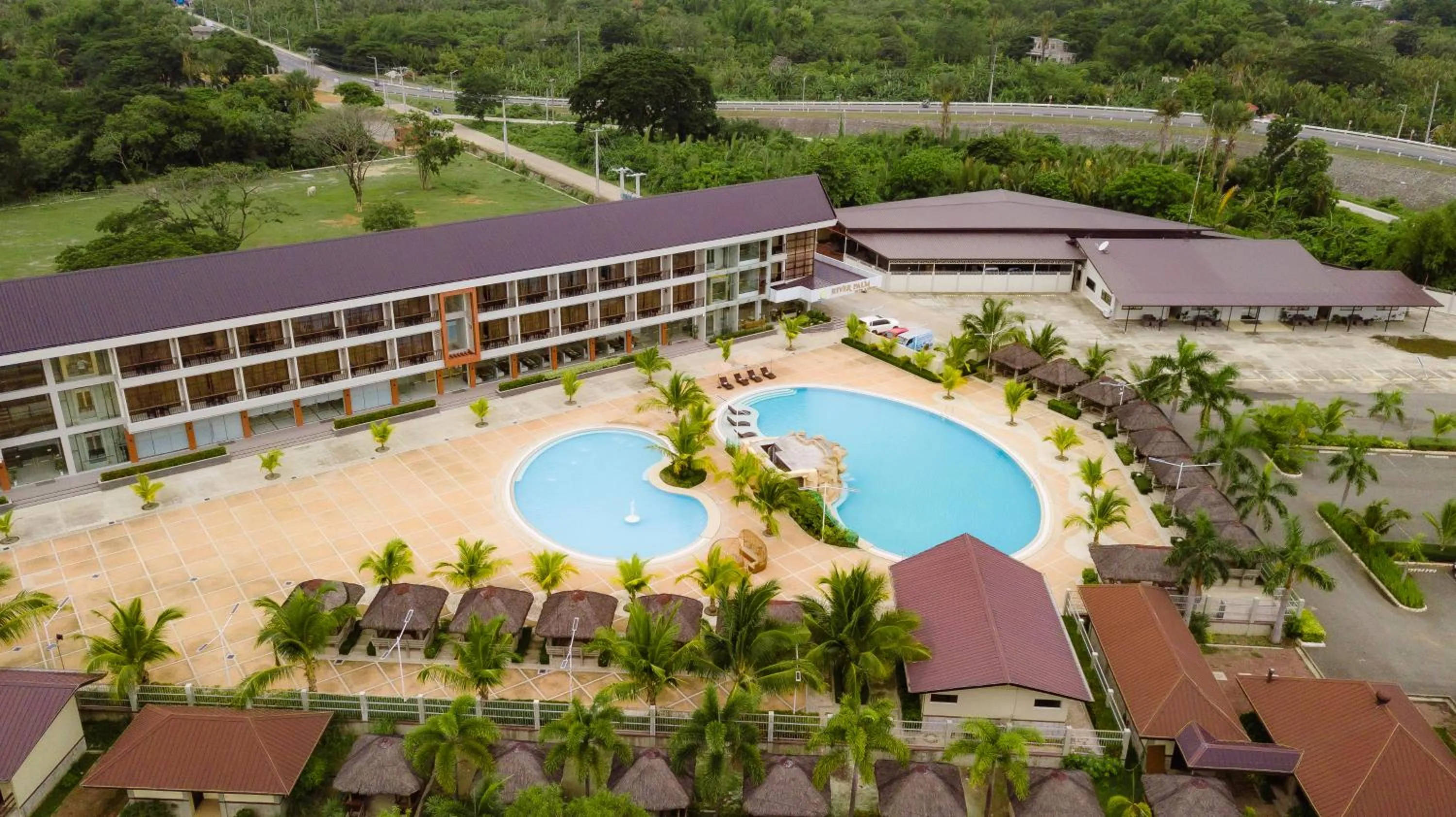 Property building in River Palm Hotel and Resort powered by Cocotel