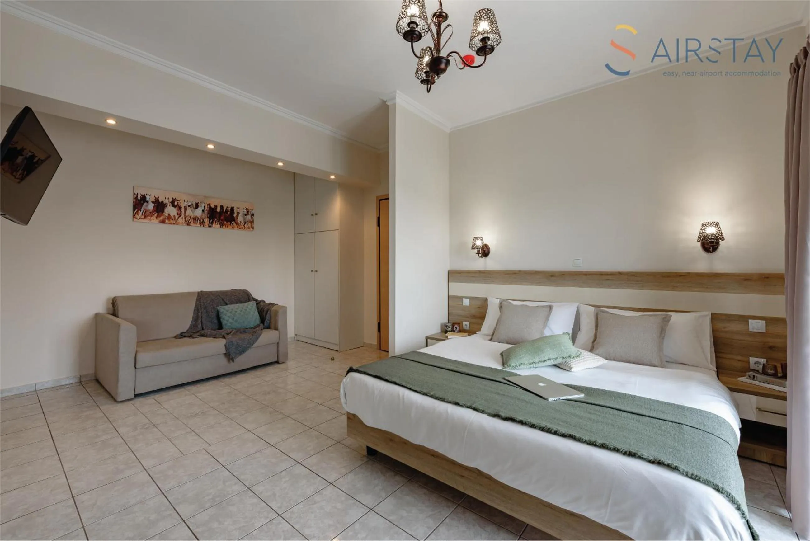 Living room, Bed in Zilean Apartments Airport by Airstay