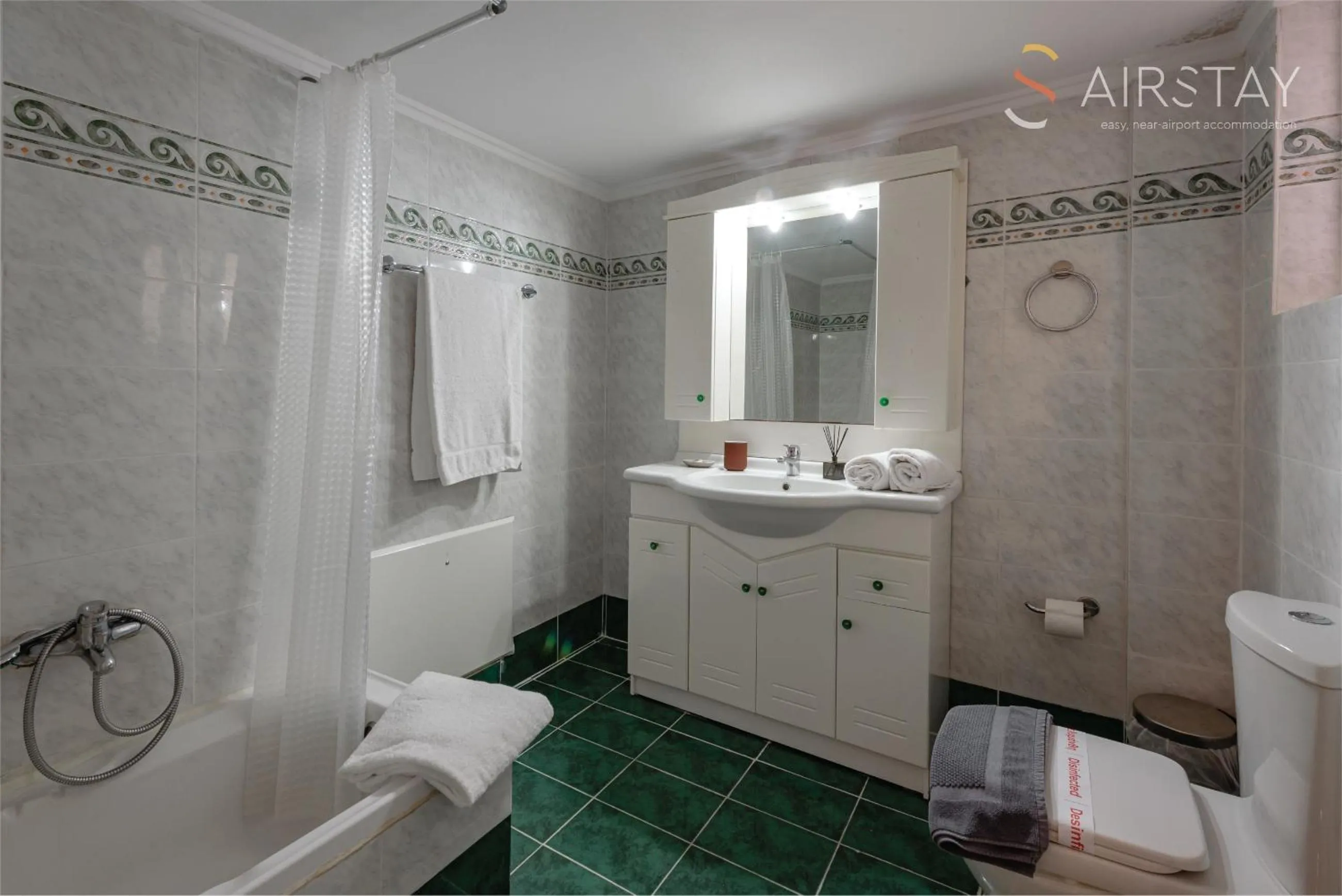 Bathroom in Zilean Apartments Airport by Airstay