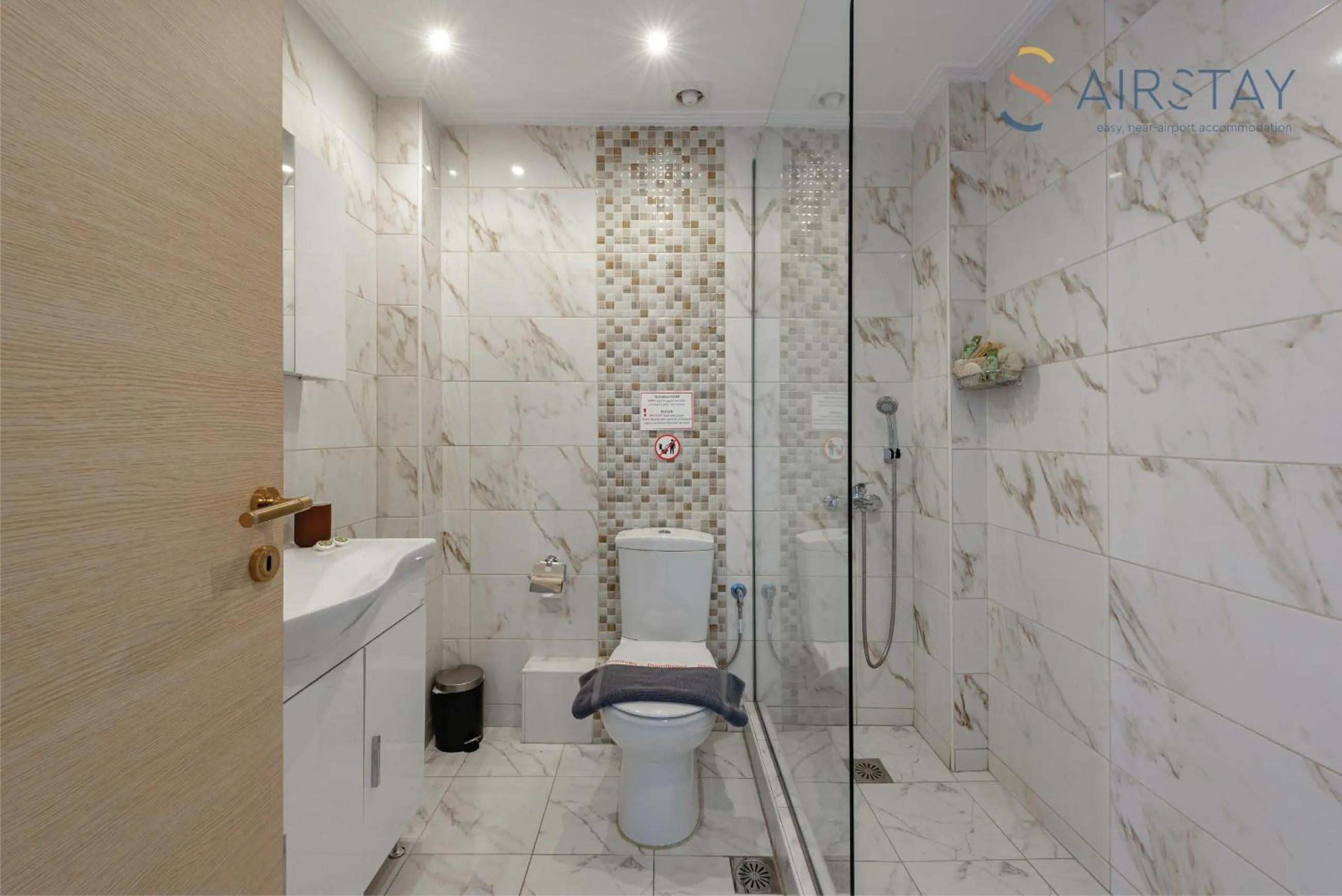 Bathroom in Zilean Apartments Airport by Airstay