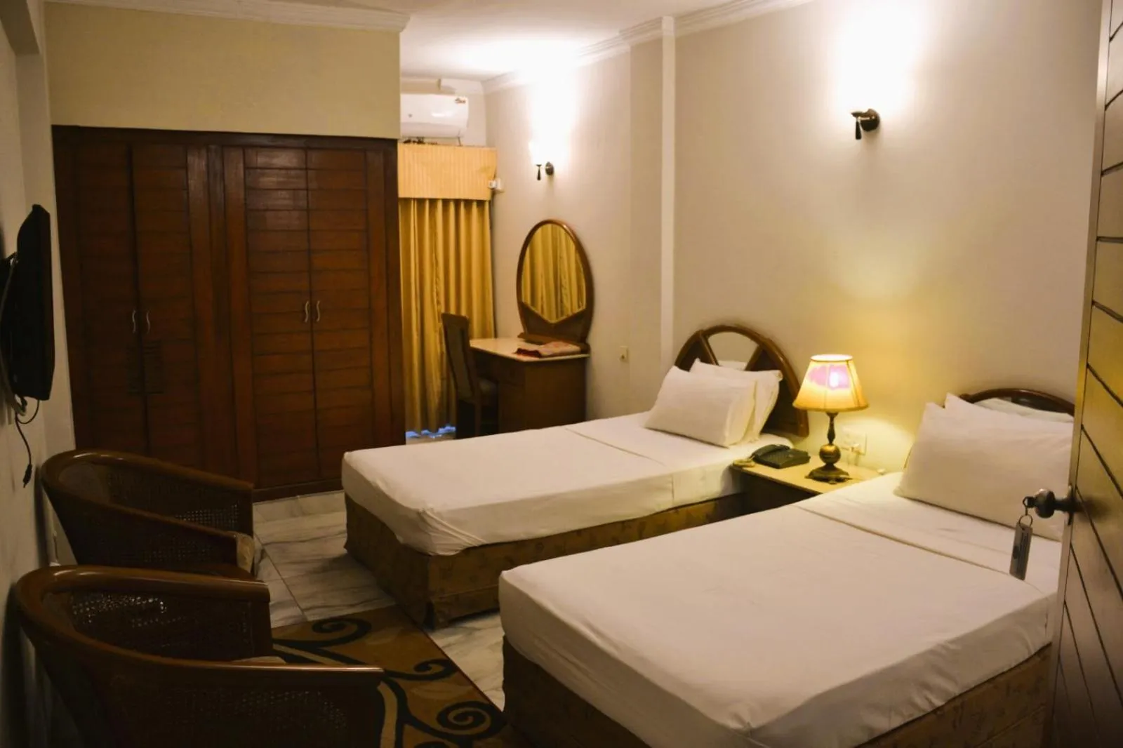 Bed in Pak Continental Hotel