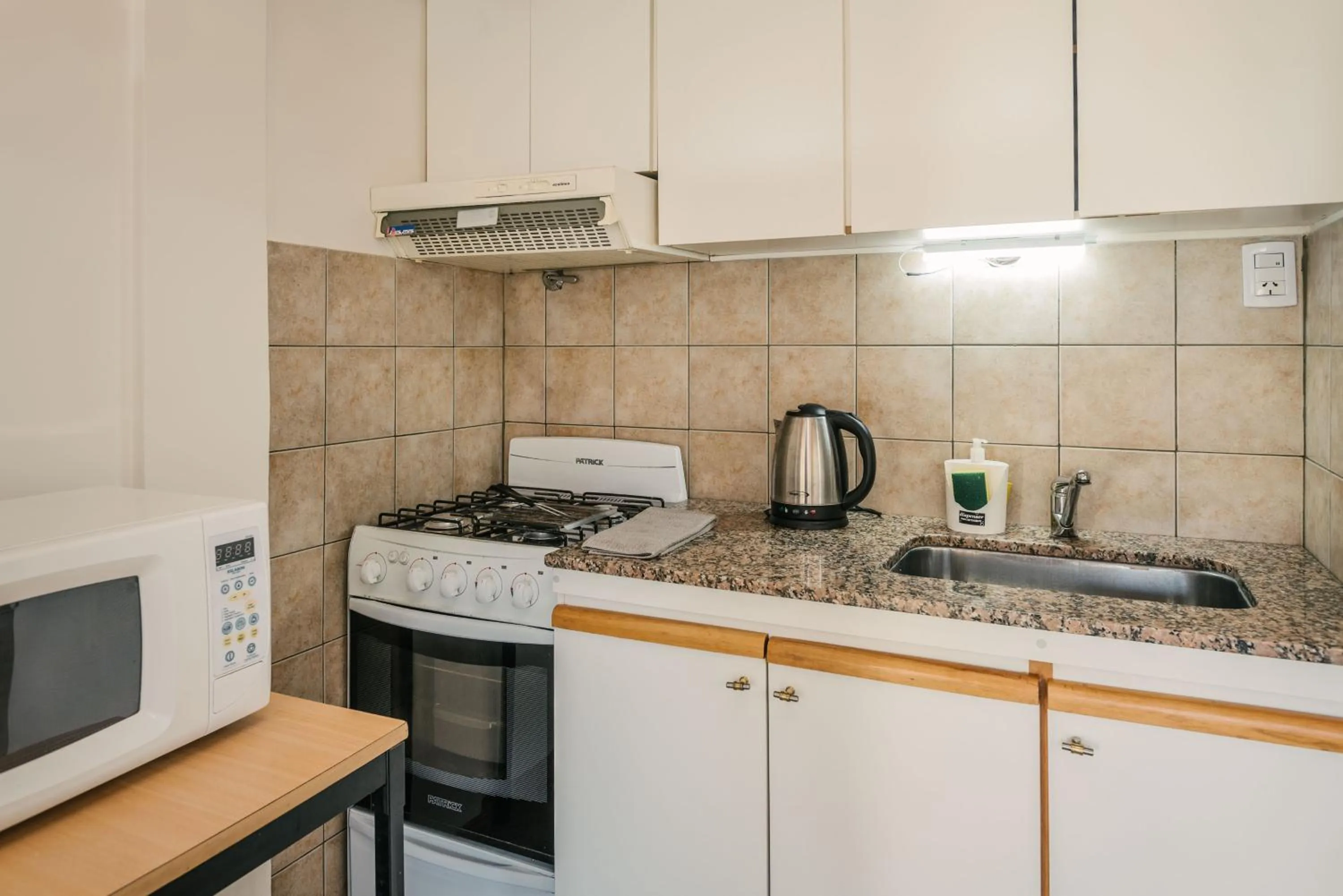 Kitchen or kitchenette in Choconcito Apart Hotel