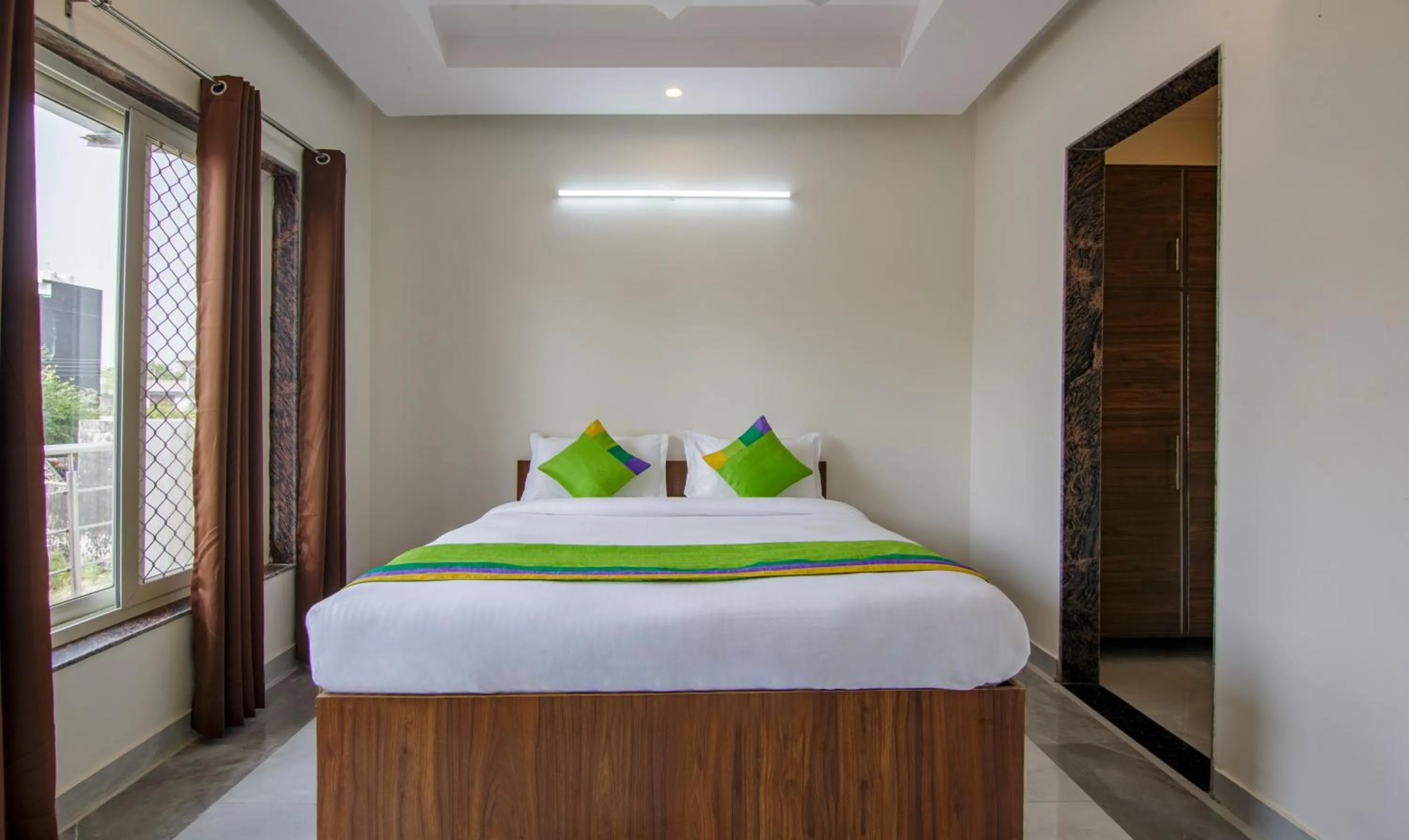 Bedroom, Bed in Treebo Grand Vista - 62