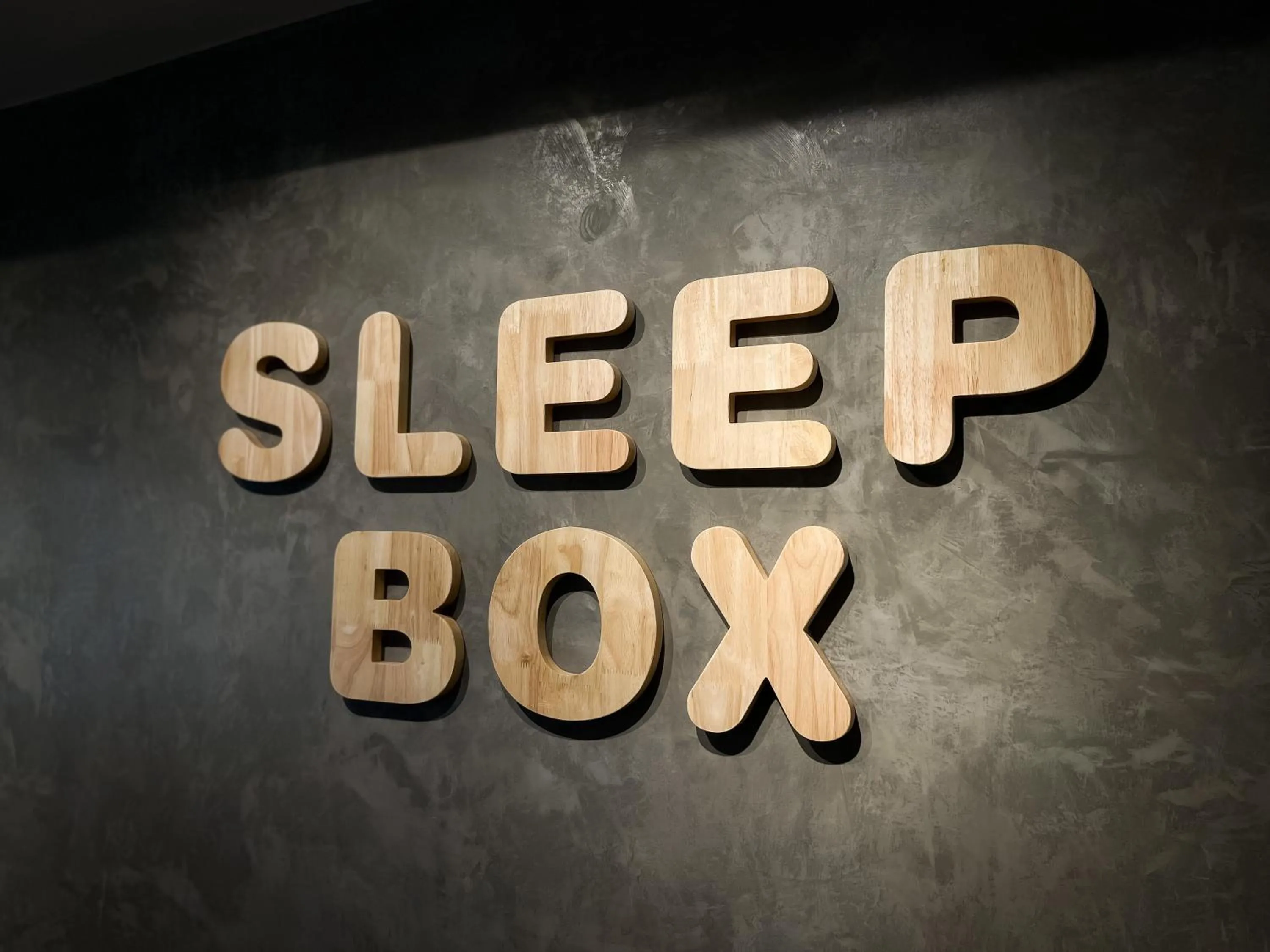 Property logo or sign in Sleep Box Penang
