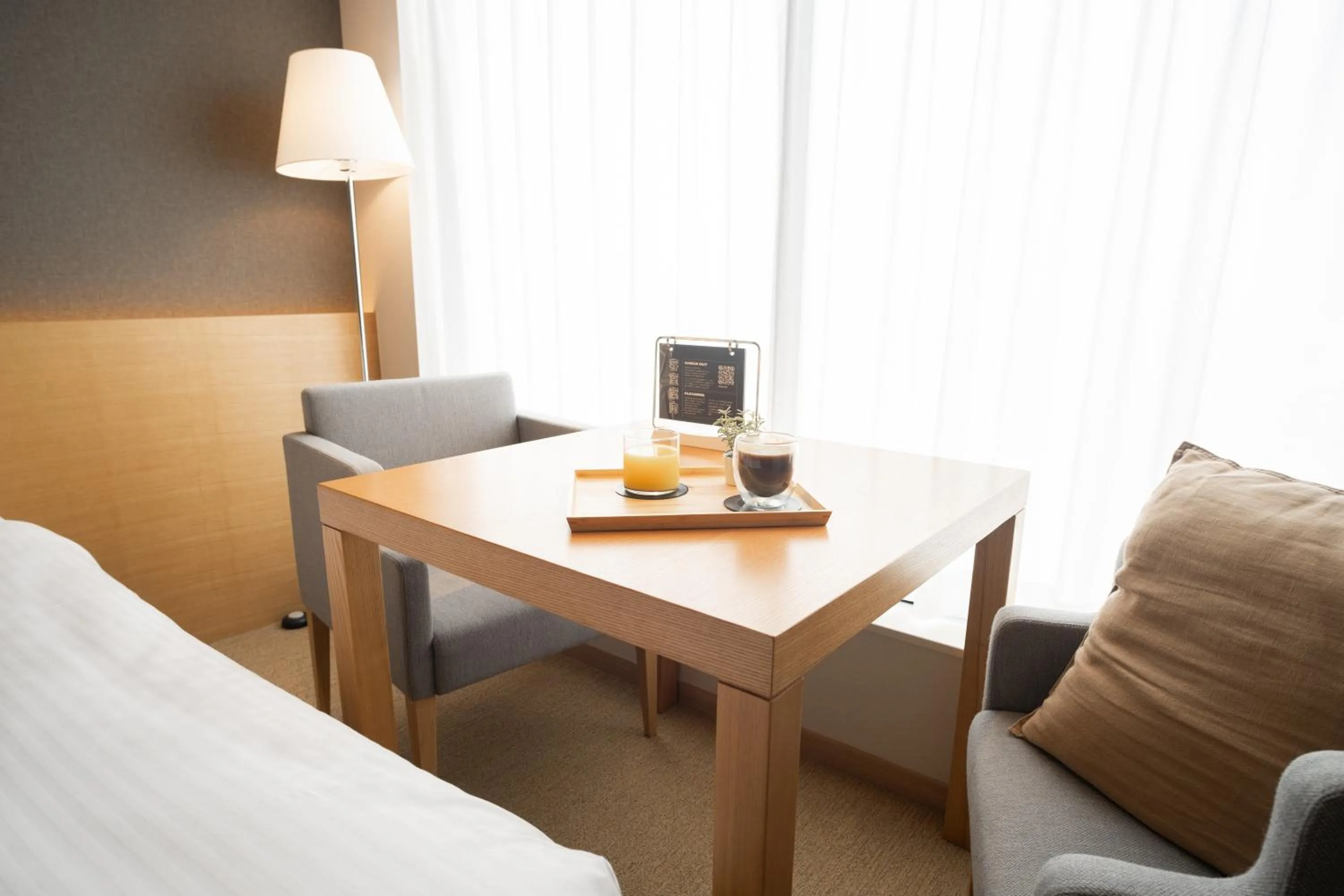 Seating area, Bed in KABIN Taka