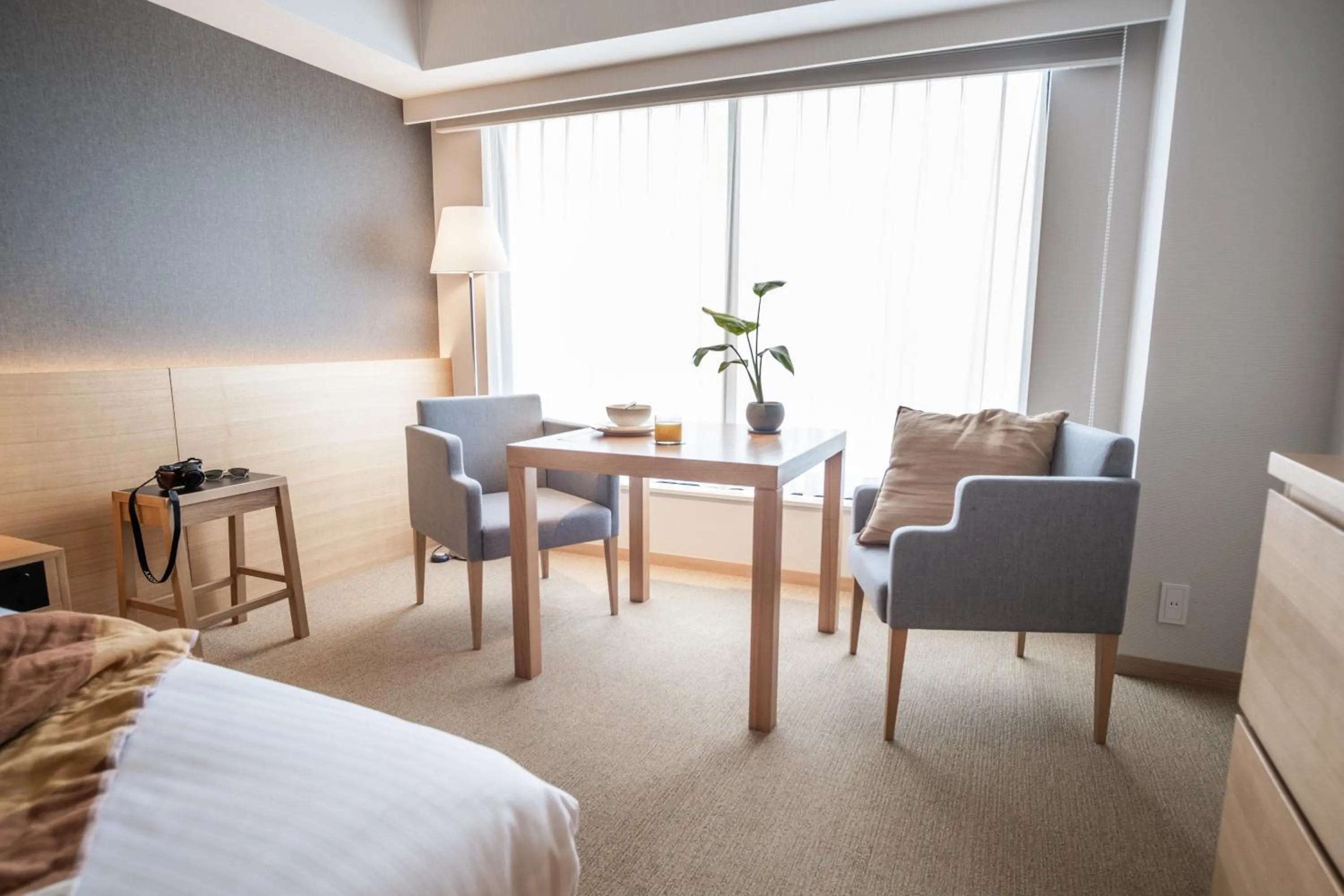 Seating area, Bed in KABIN Taka