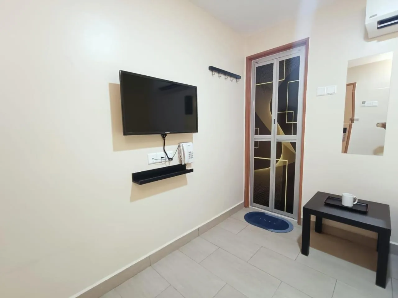 Bedroom in Capital O 90897 Island City Hotel