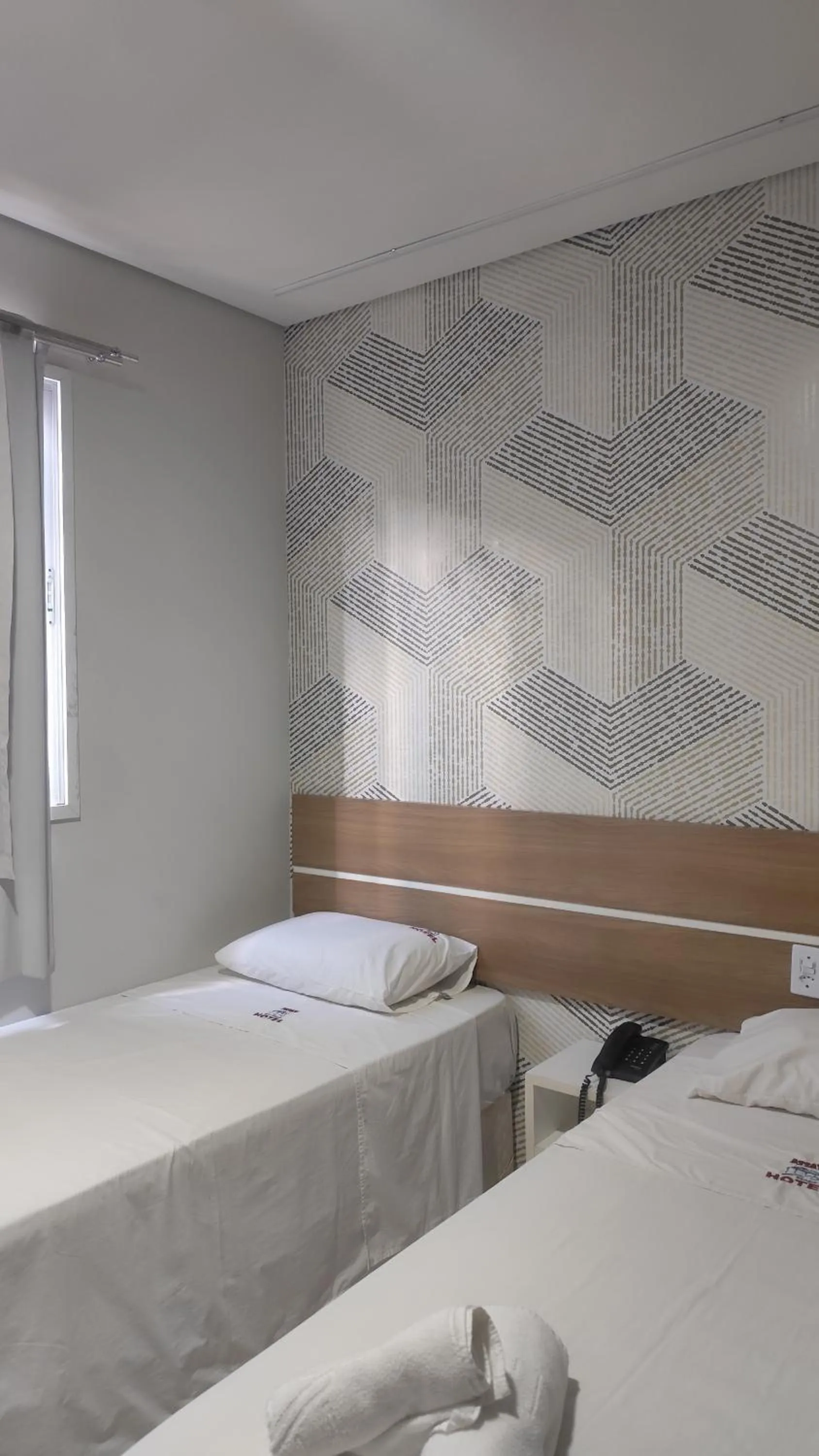 Bed in Assay Plaza Hotel