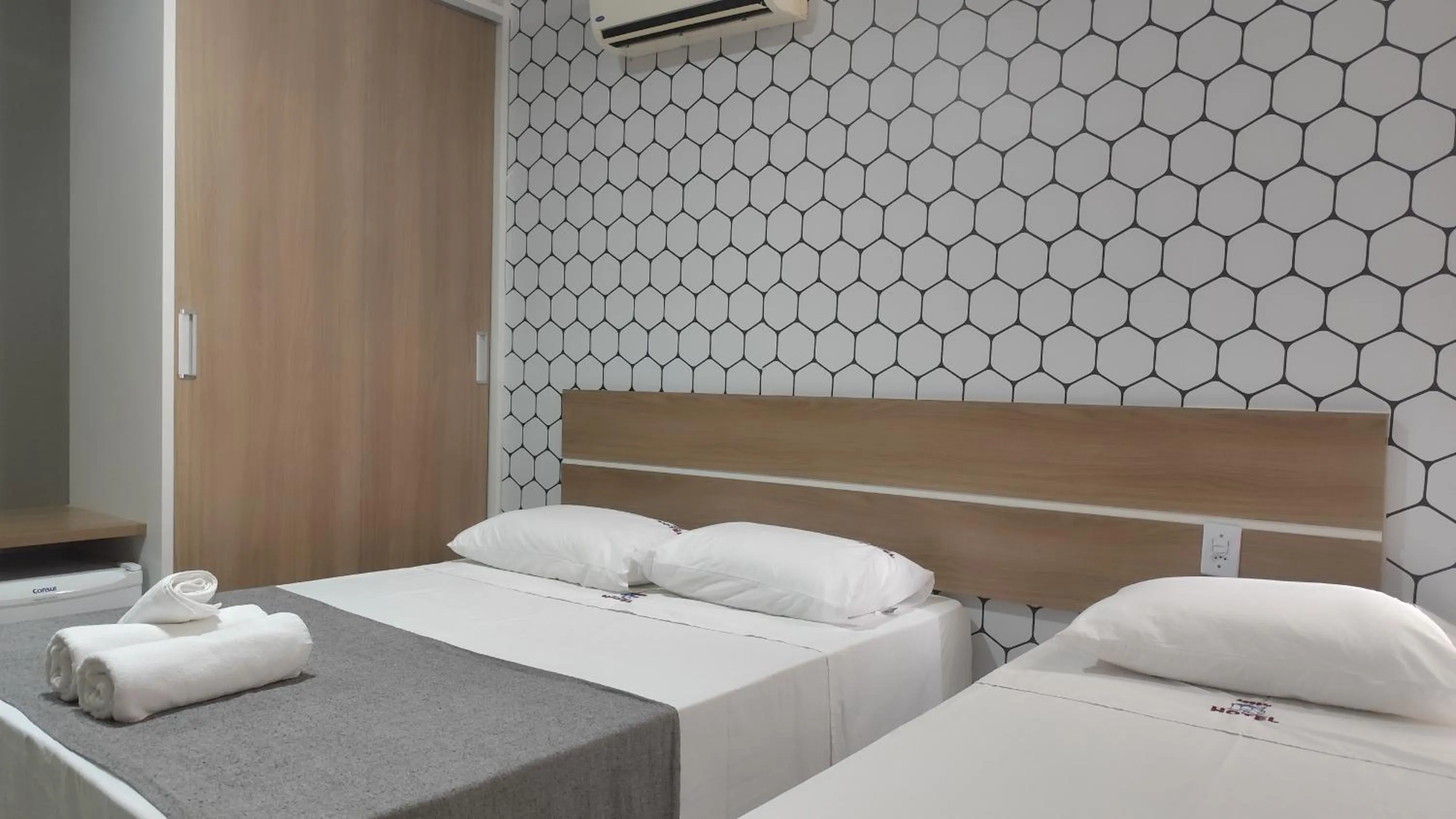 Bed in Assay Plaza Hotel