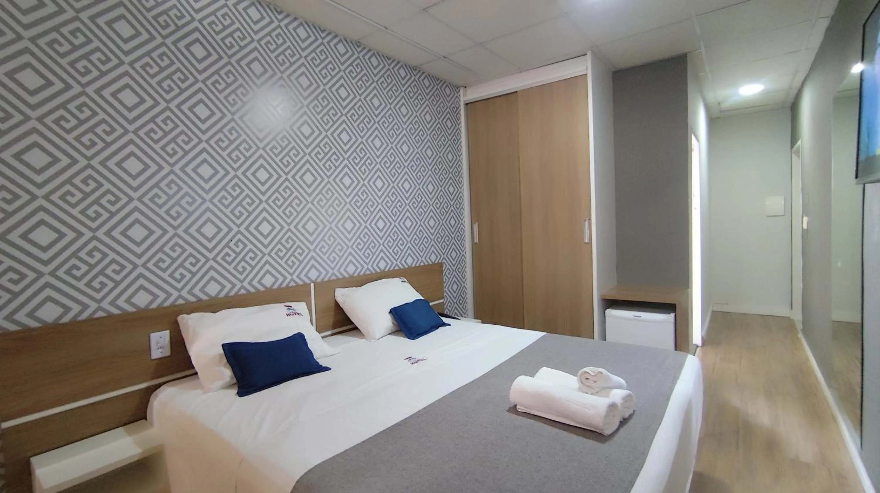 Bed in Assay Plaza Hotel