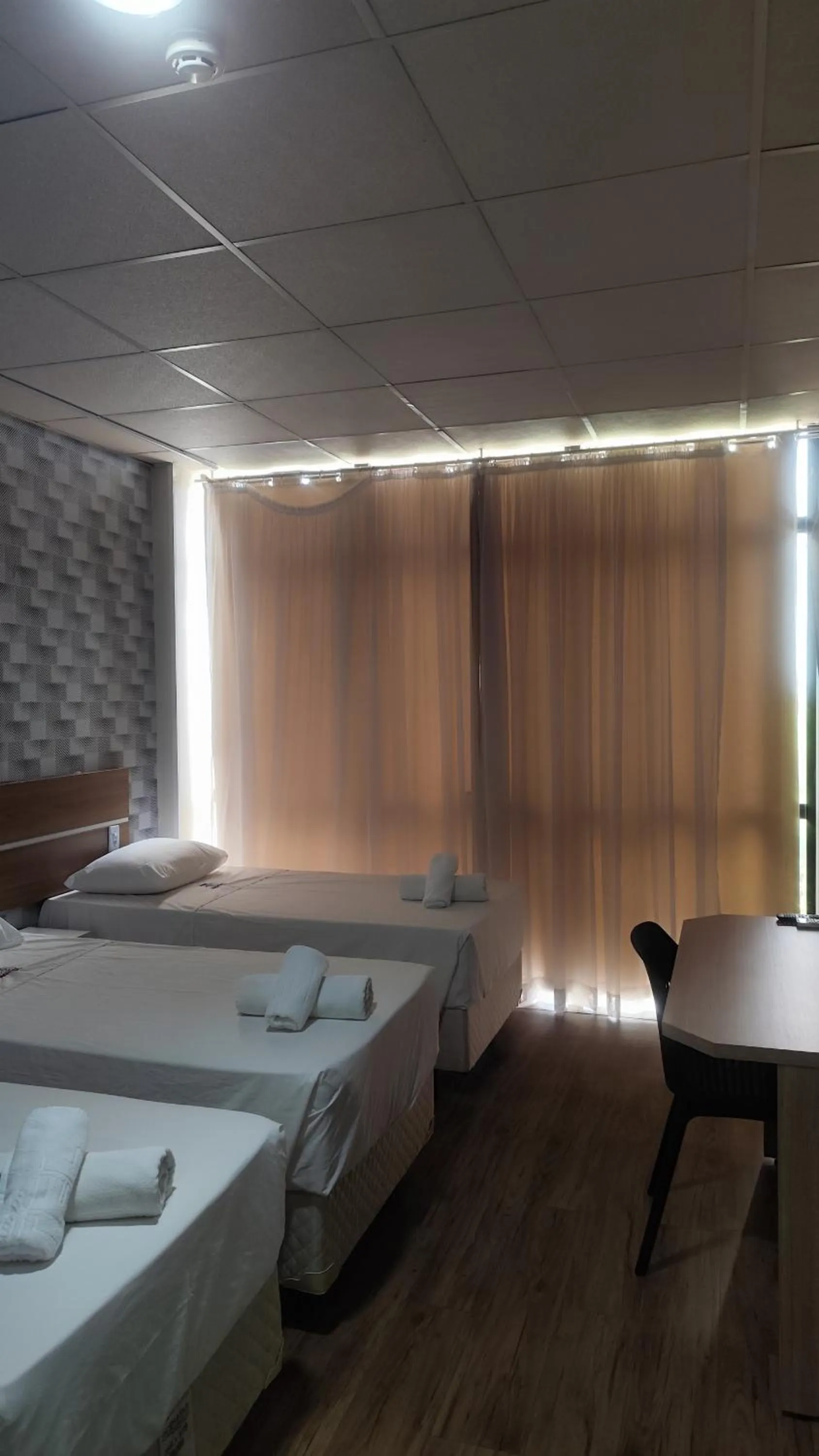 Bed in Assay Plaza Hotel