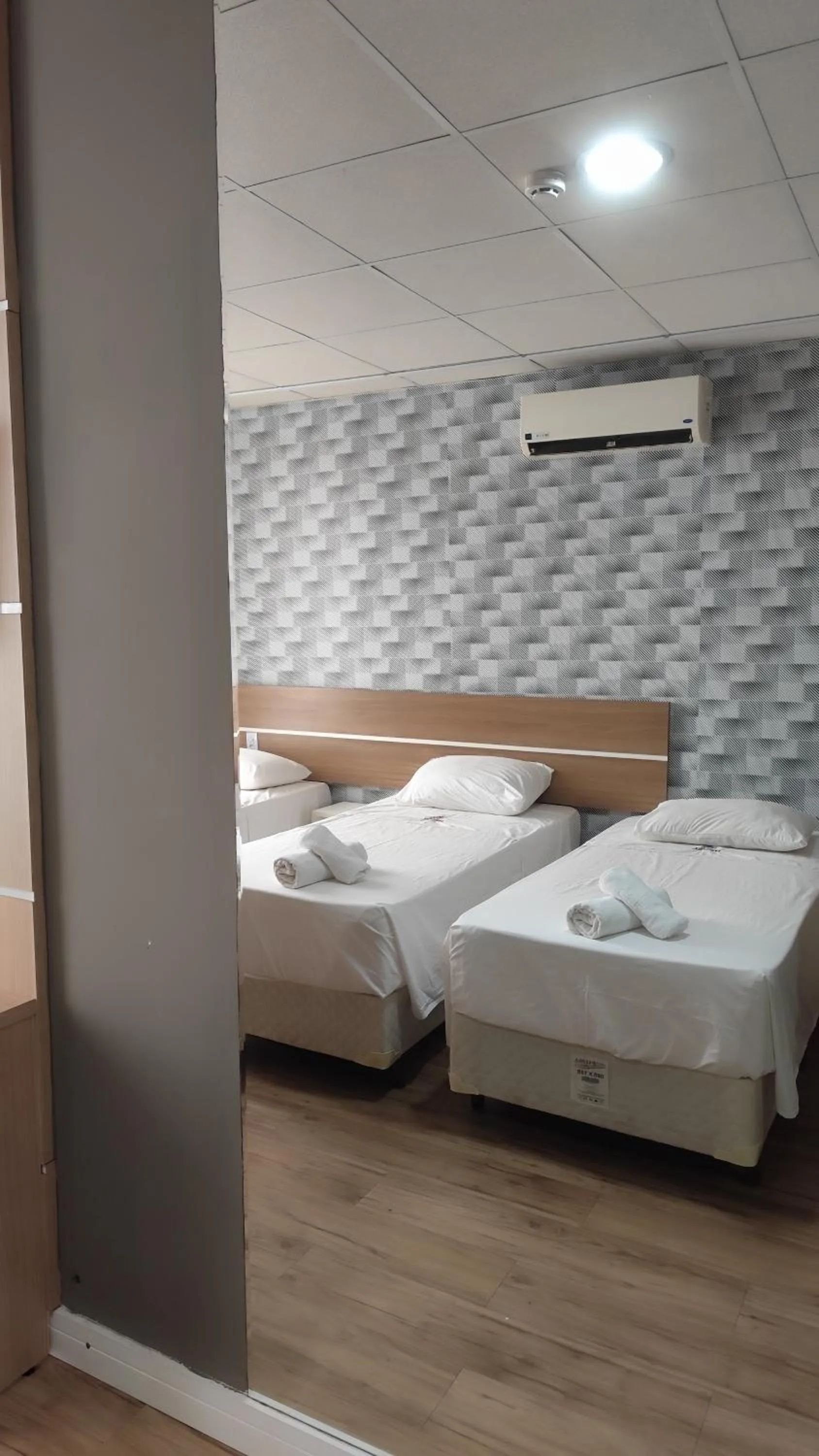 Bed in Assay Plaza Hotel