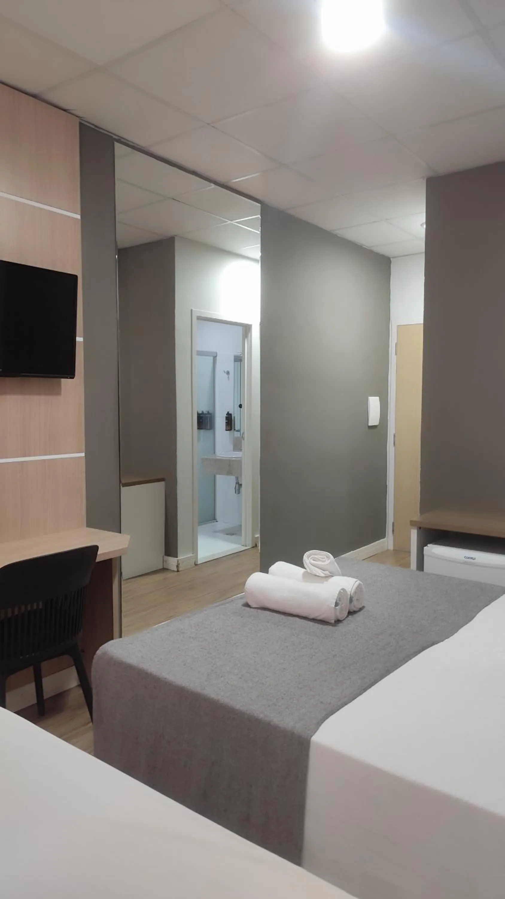 Bed in Assay Plaza Hotel