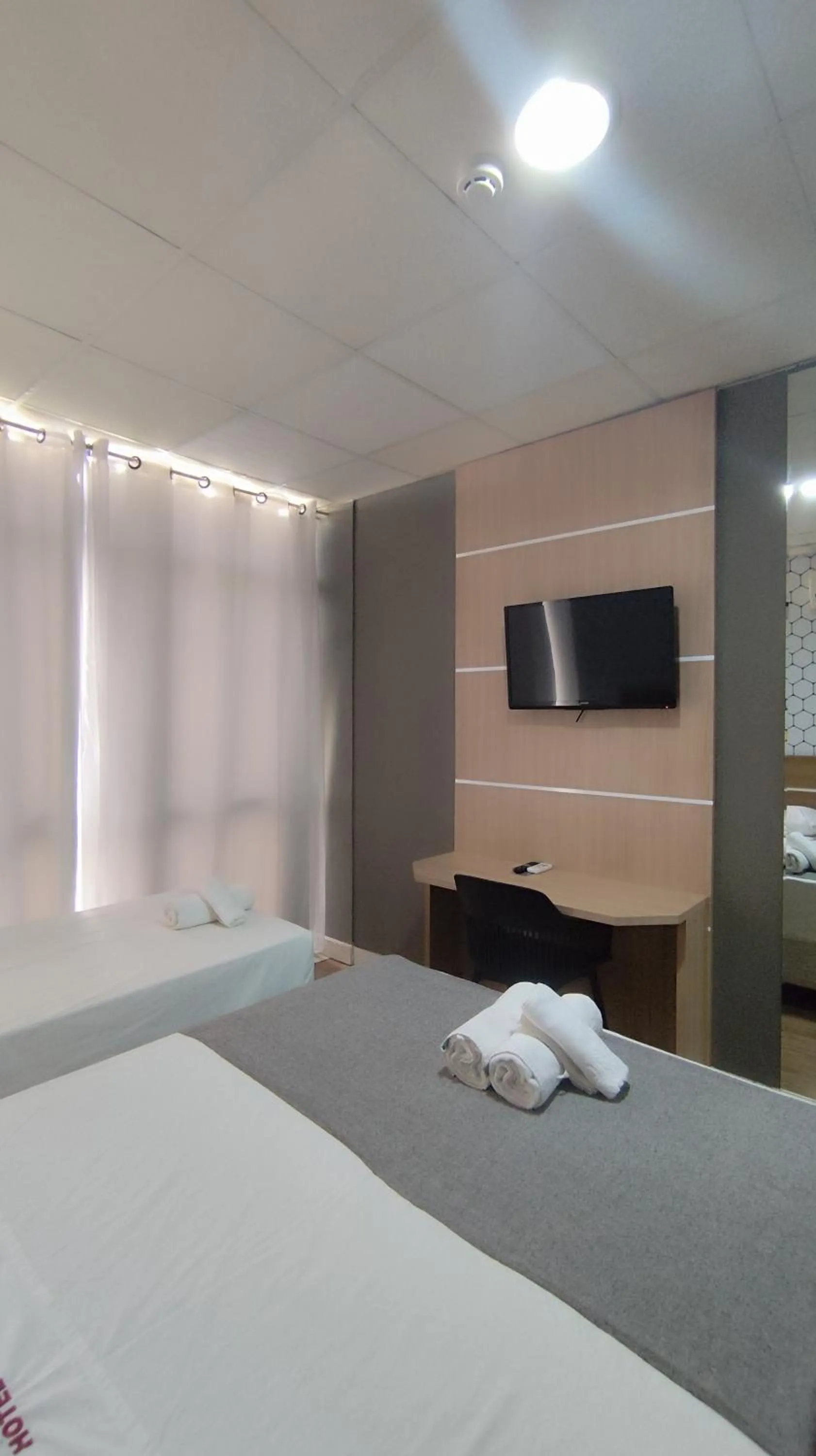 Bed in Assay Plaza Hotel