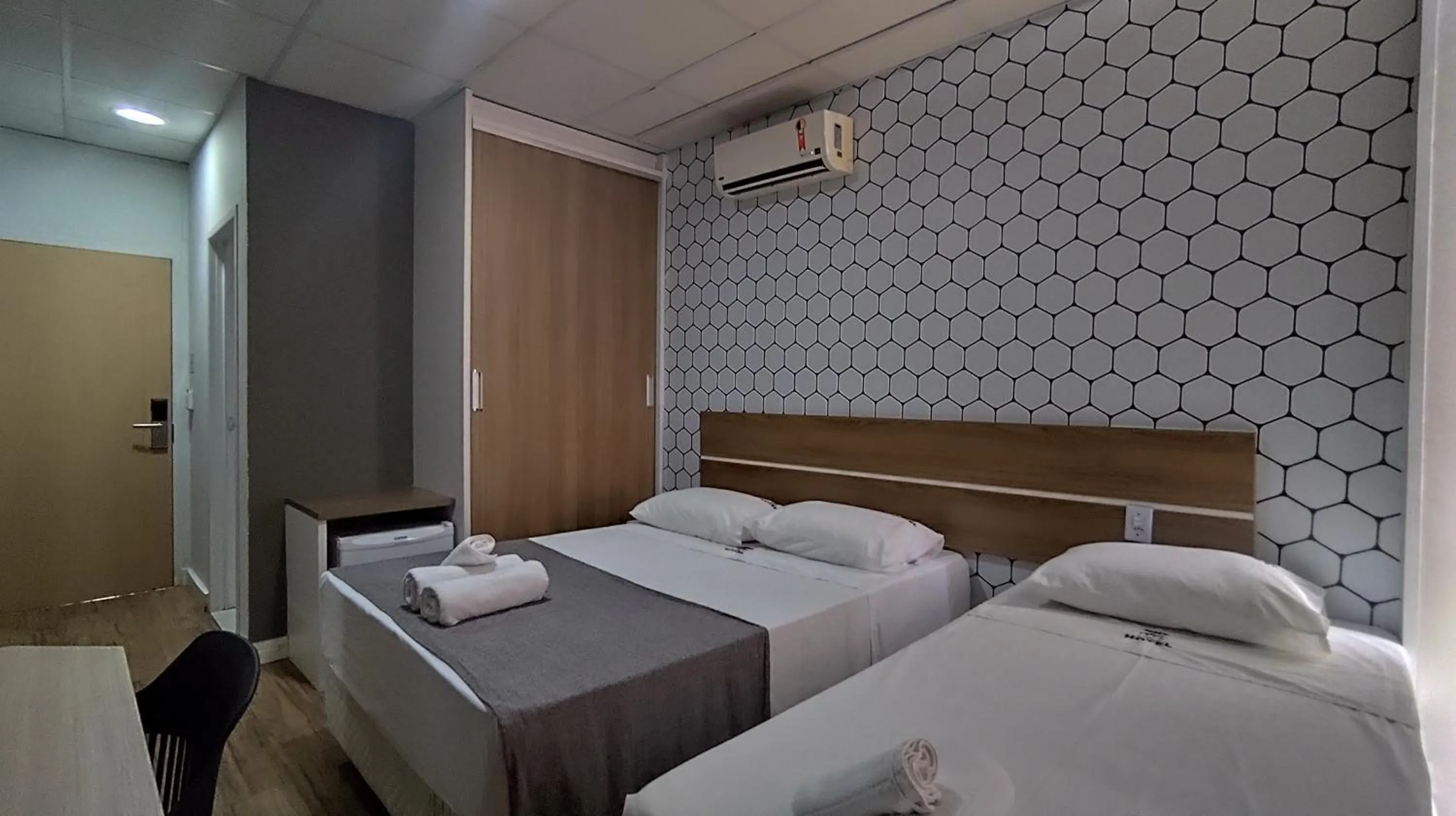 Bed in Assay Plaza Hotel