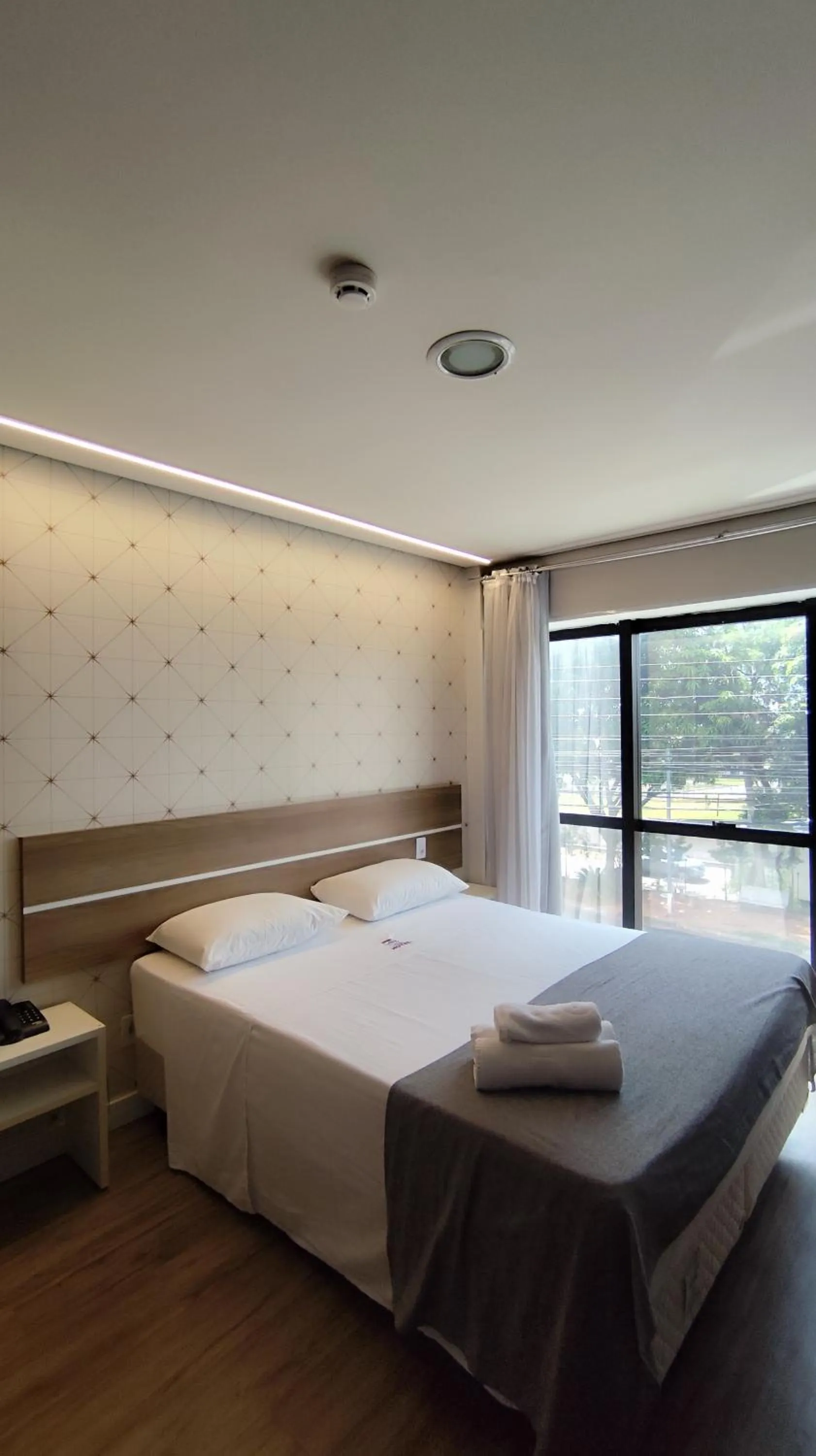 Bed in Assay Plaza Hotel