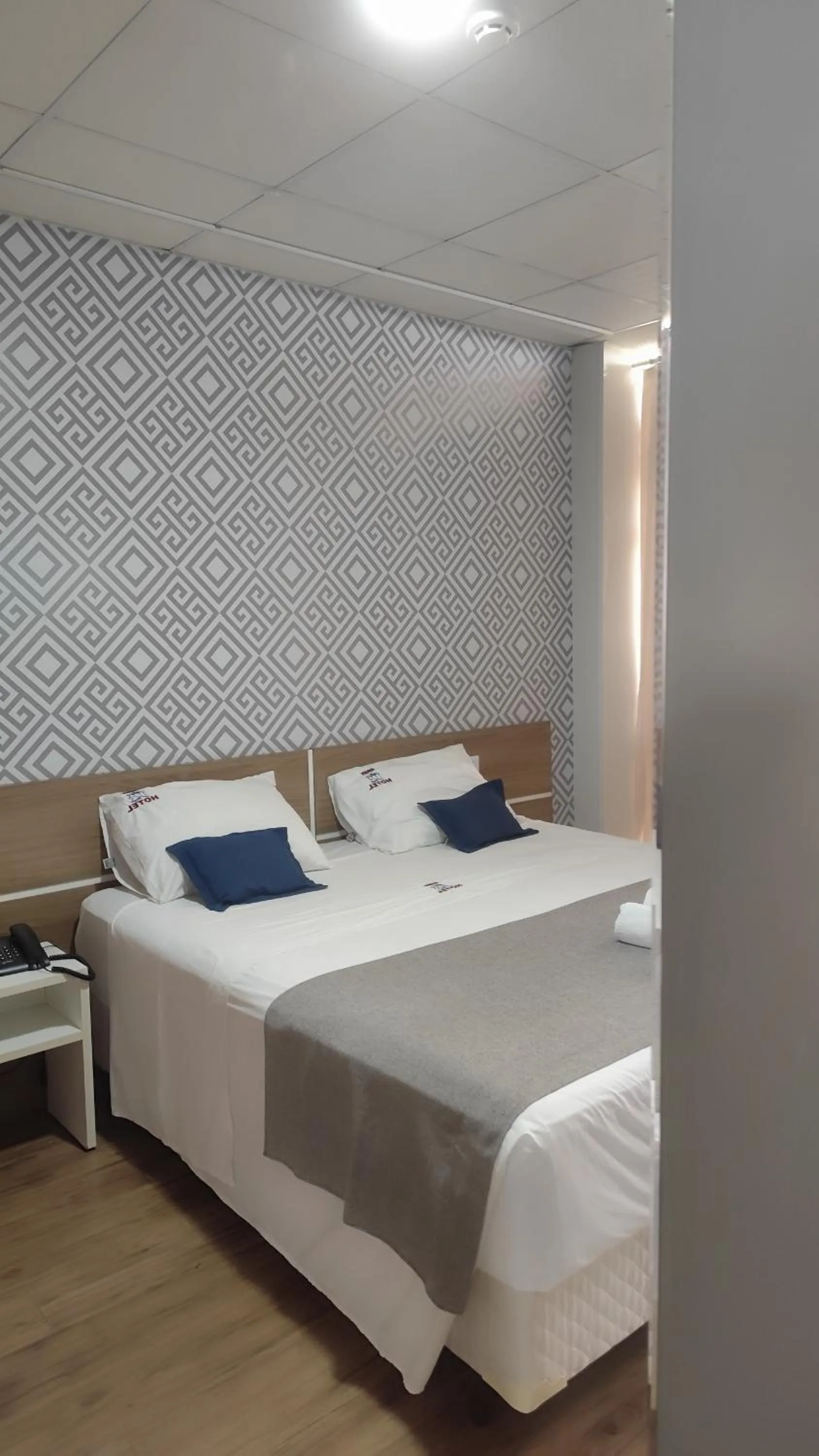 Bed in Assay Plaza Hotel