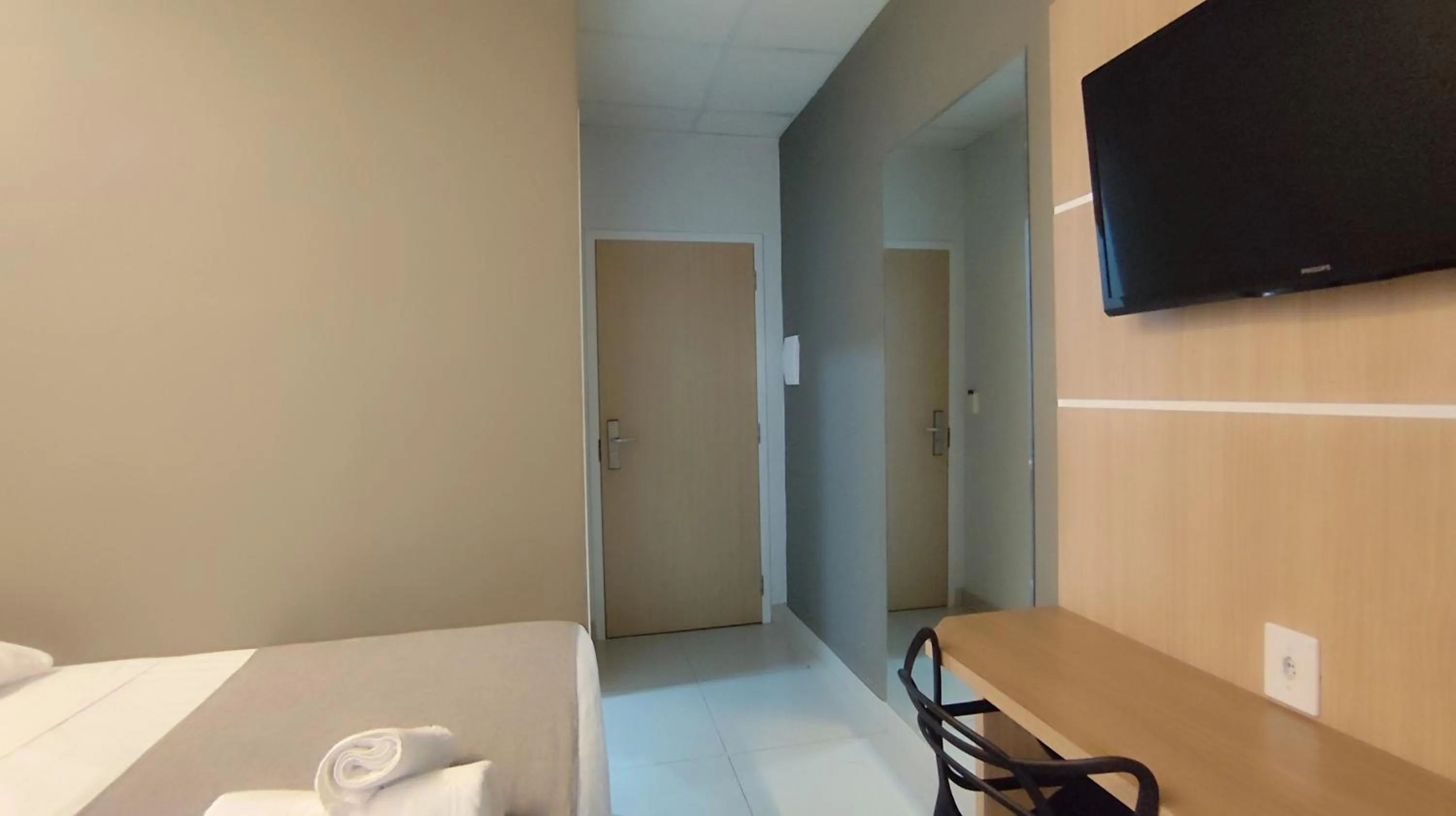 Bed in Assay Plaza Hotel