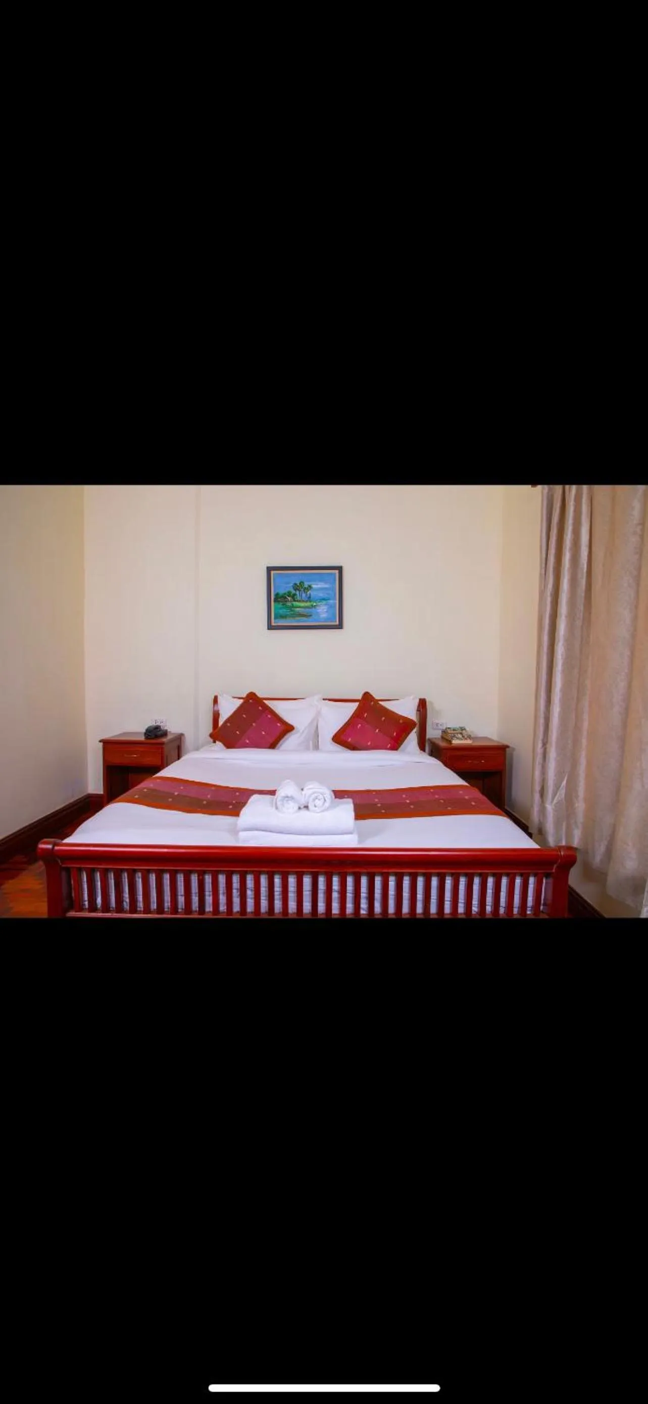 Bed in Phongsavath Boutique Hotel