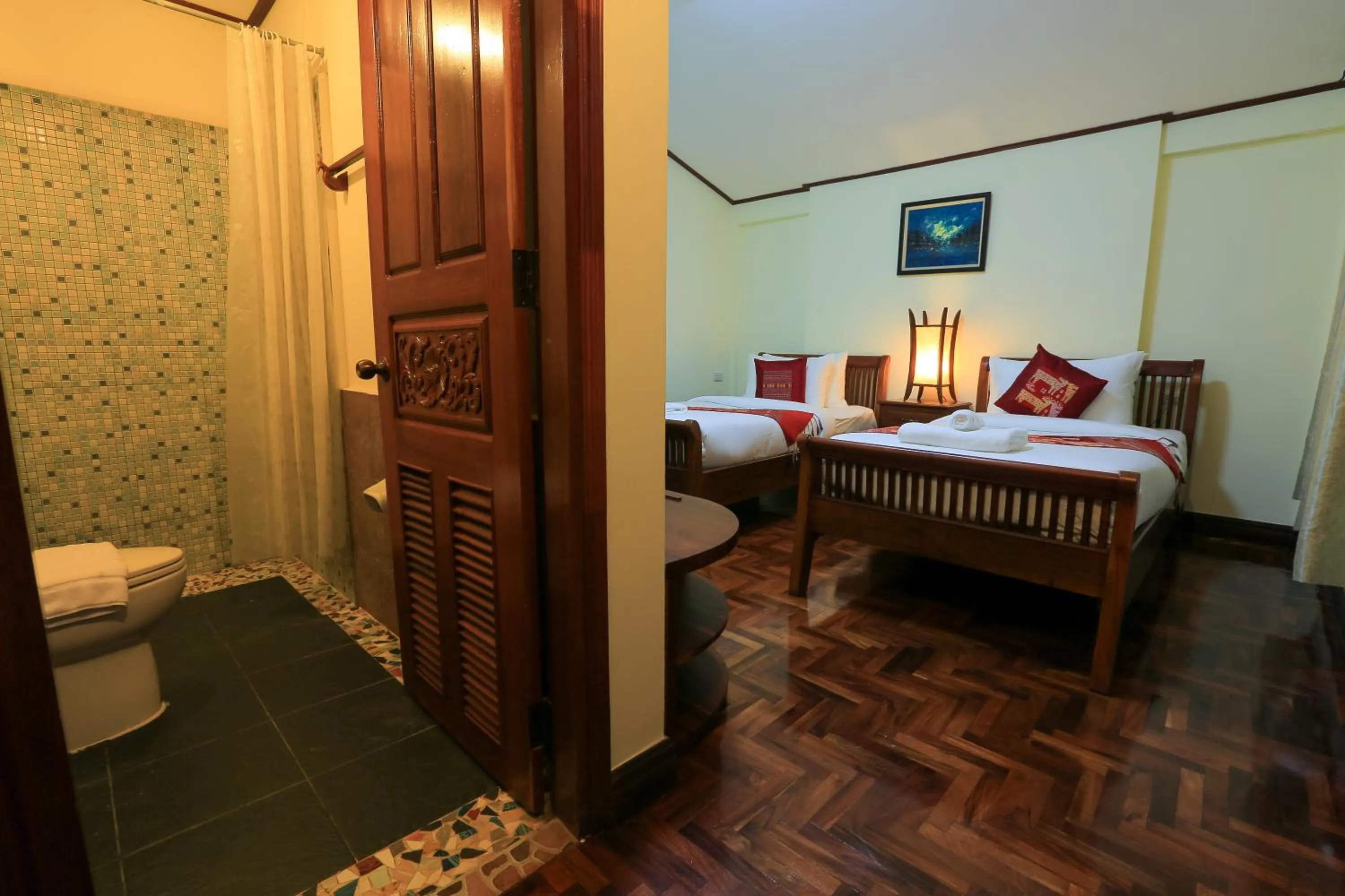 Bed in Phongsavath Boutique Hotel