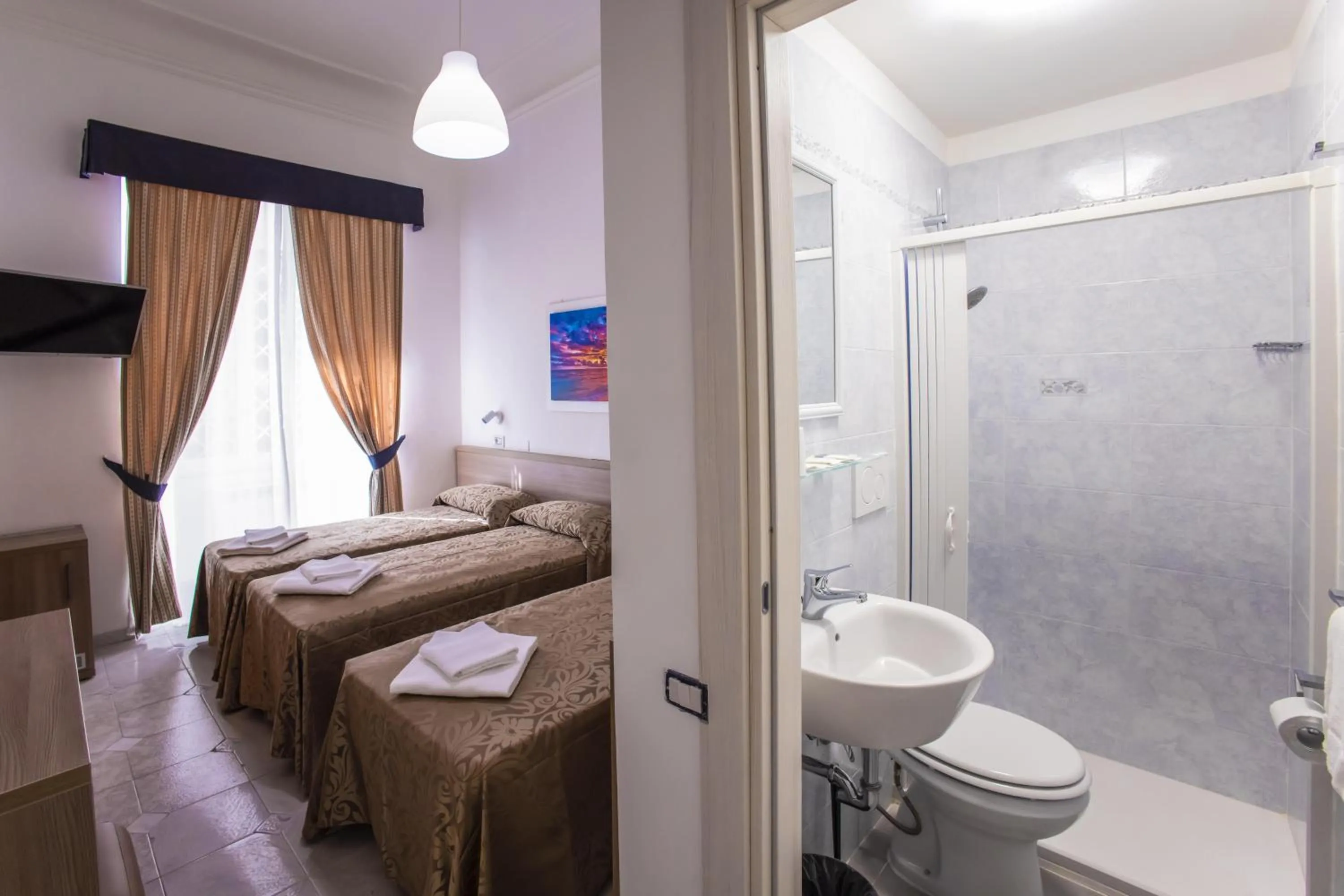 Toilet, Bed in Hotel Orbis