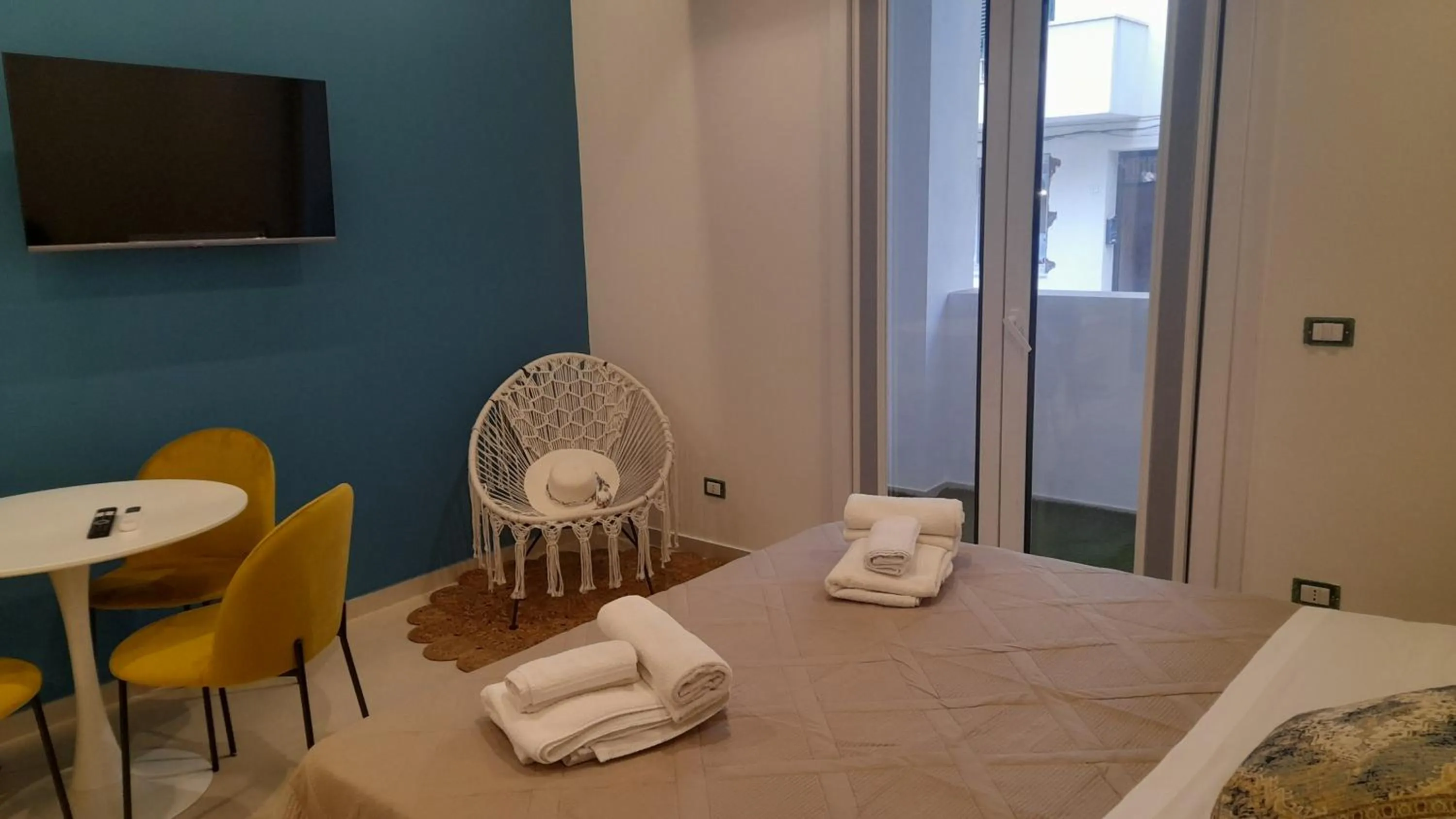 Bed in I Faraglioni Comfort Rooms