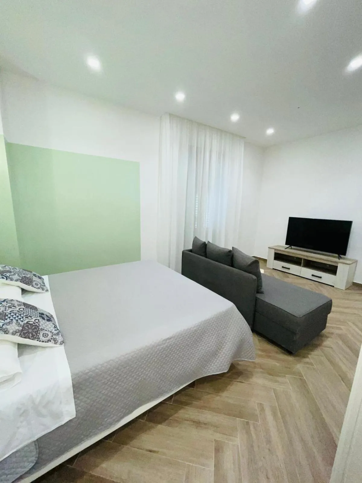 Bed in I Faraglioni Comfort Rooms