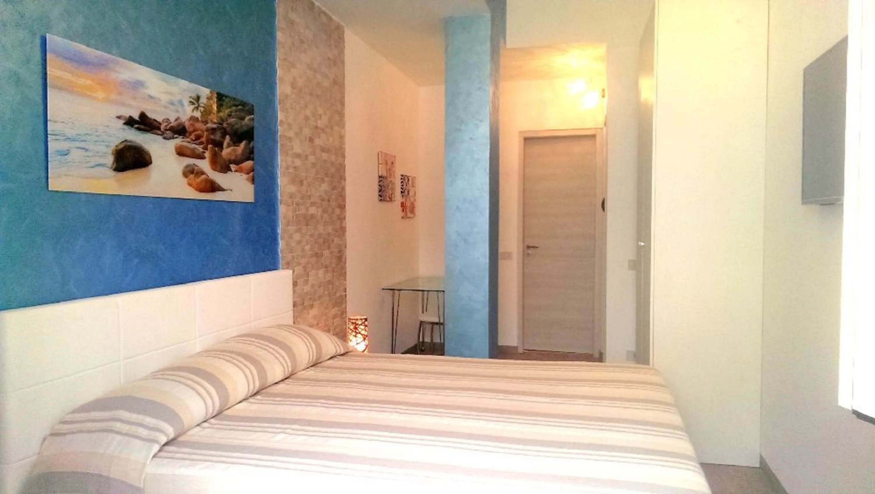 Photo of the whole room, Bed in I Faraglioni Comfort Rooms