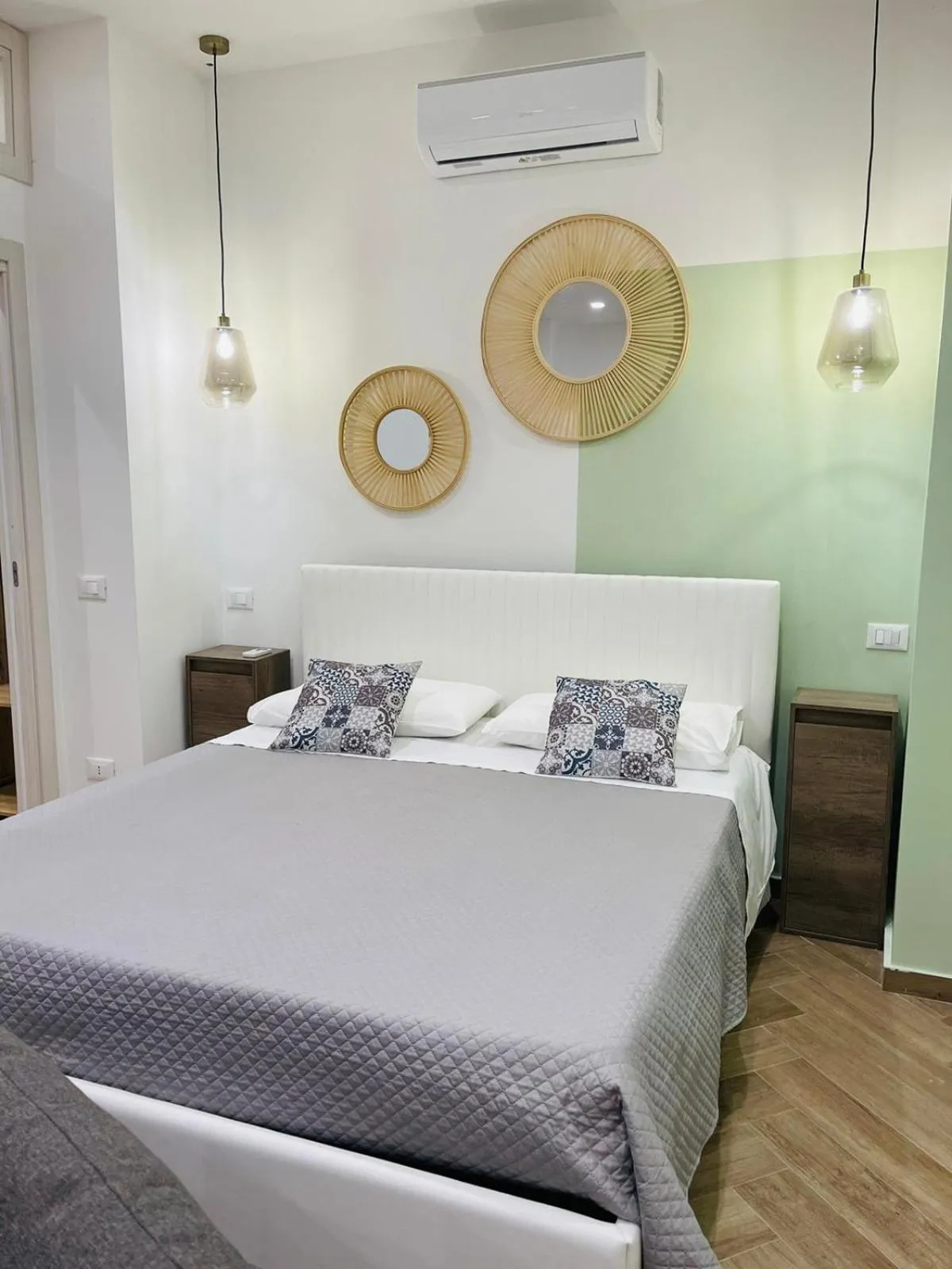 Bed in I Faraglioni Comfort Rooms