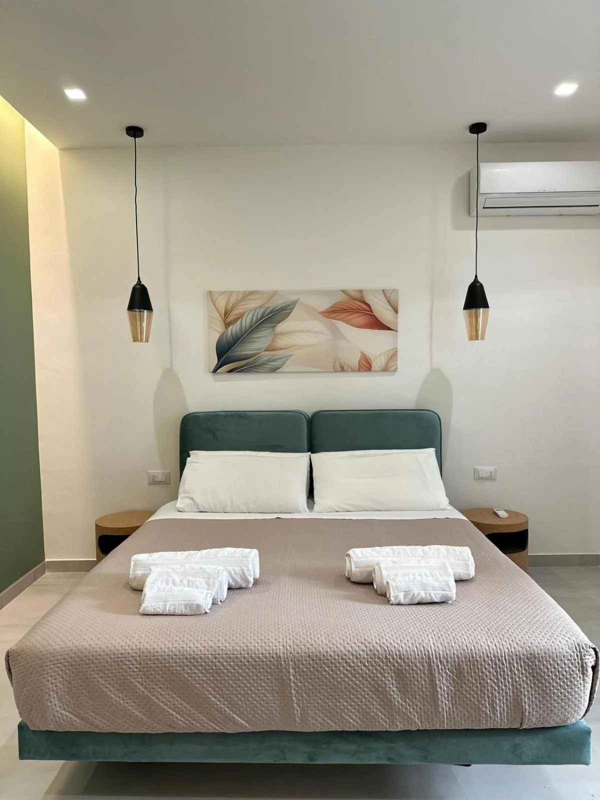 Bed in I Faraglioni Comfort Rooms