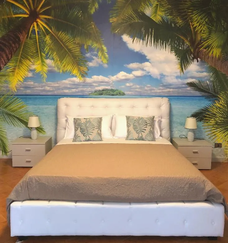 Bed in I Faraglioni Comfort Rooms
