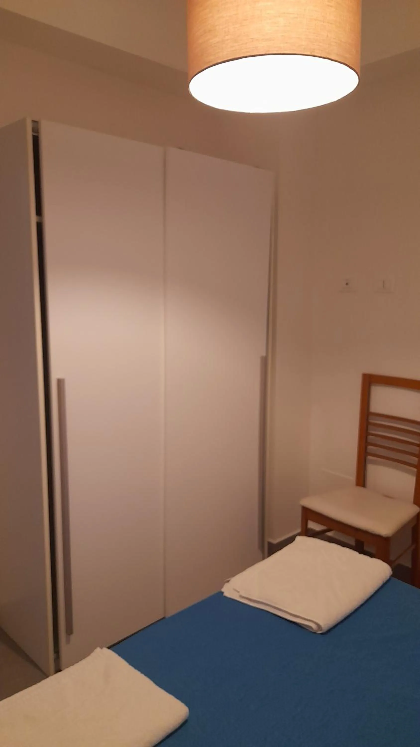 Bed in I Faraglioni Comfort Rooms