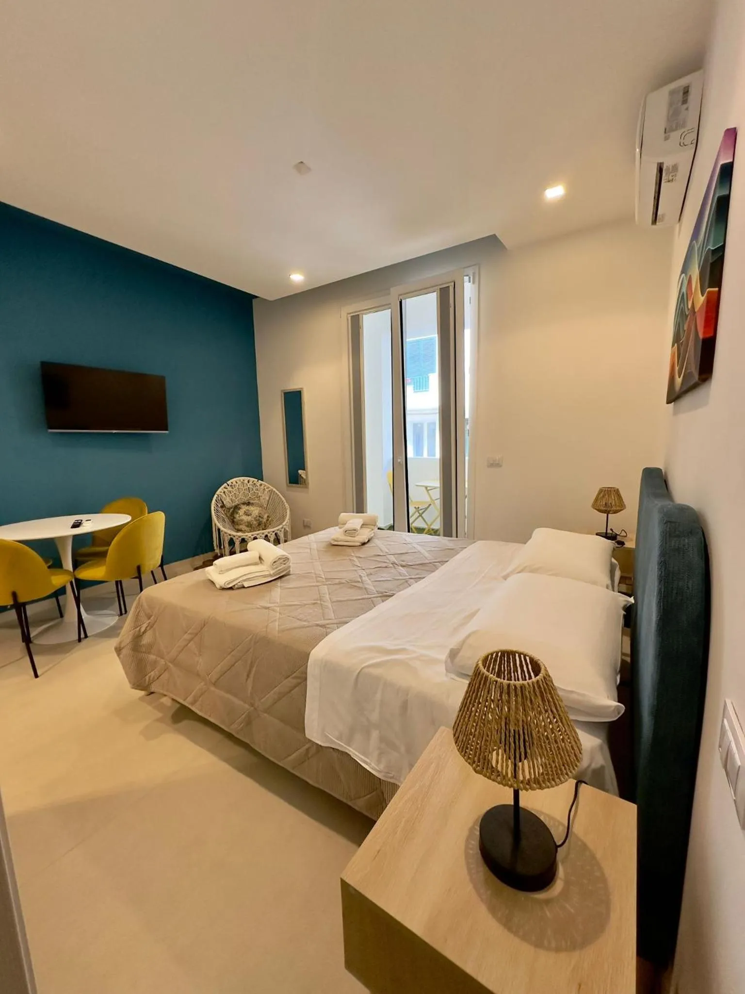 Bed in I Faraglioni Comfort Rooms