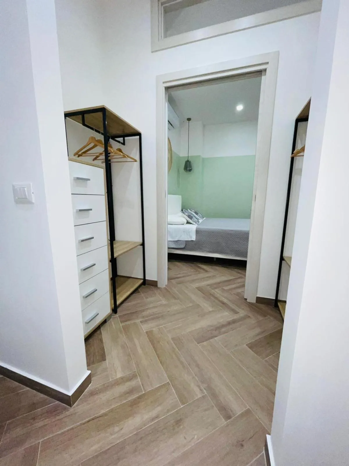 Bed in I Faraglioni Comfort Rooms
