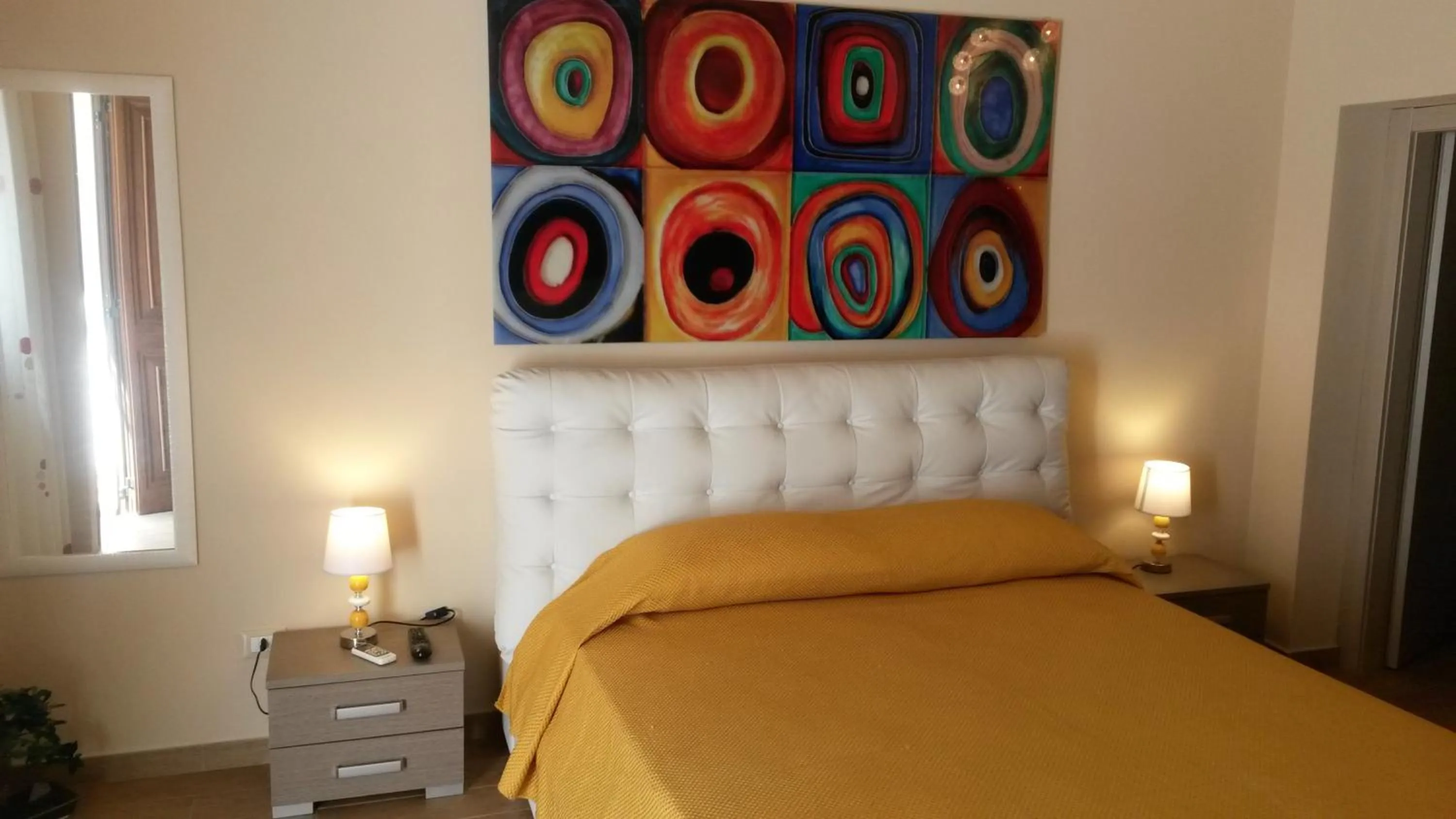 Bed in I Faraglioni Comfort Rooms