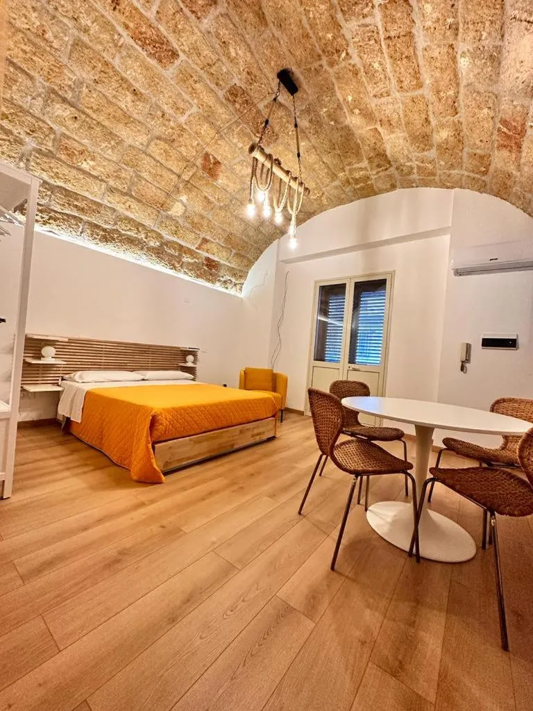 Bed in I Faraglioni Comfort Rooms