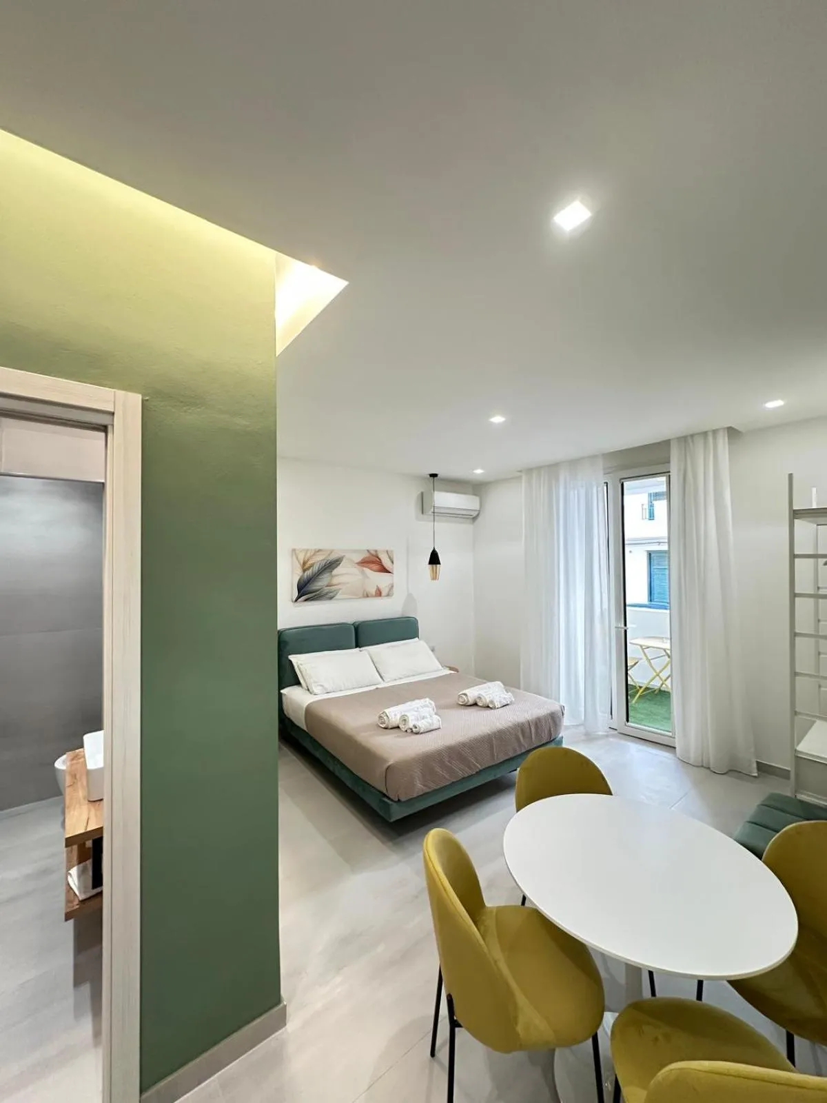 Bed in I Faraglioni Comfort Rooms